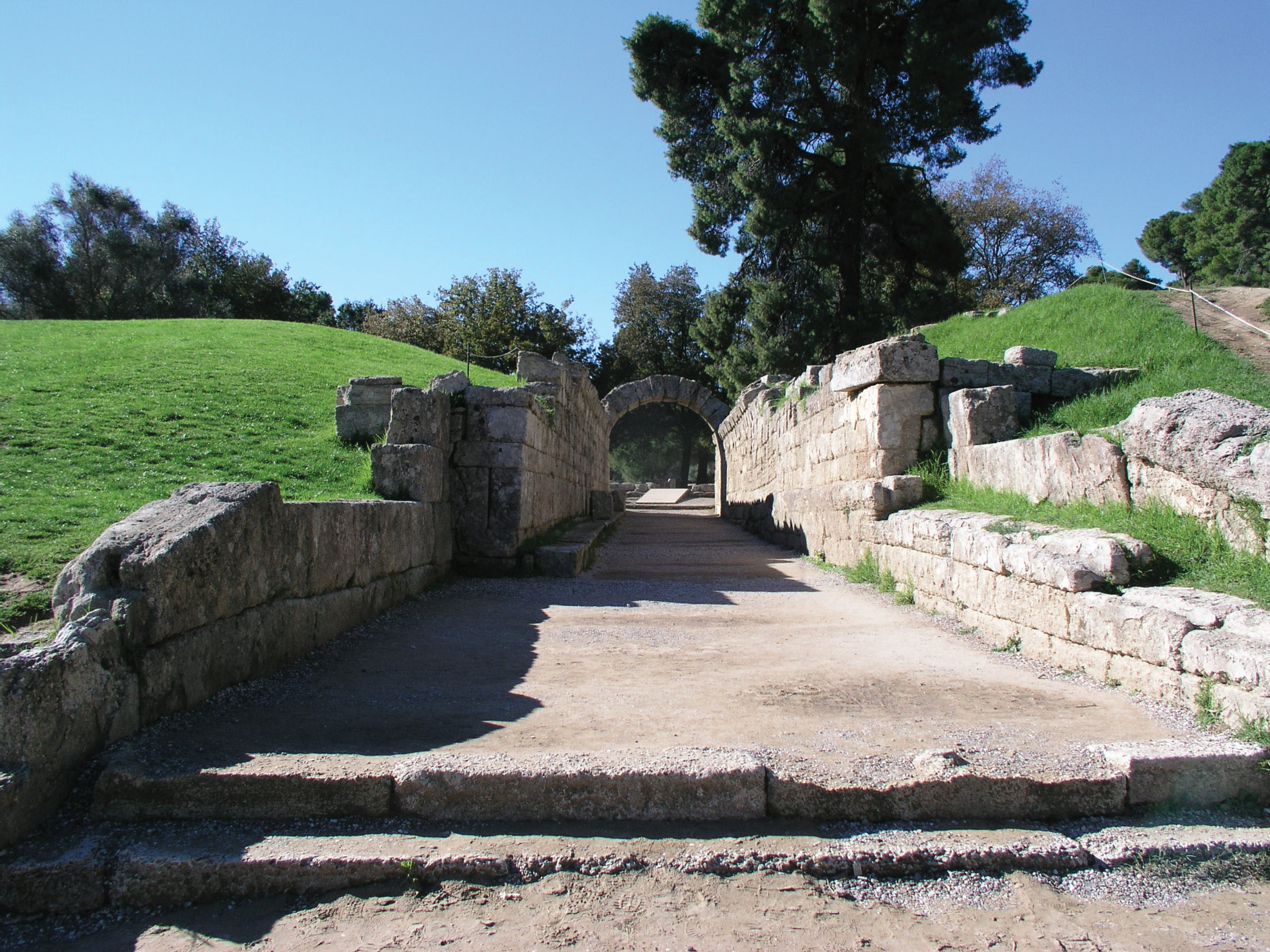 BELOW View from the stadium of its monumental entrance tunnel, the krypte stoa.