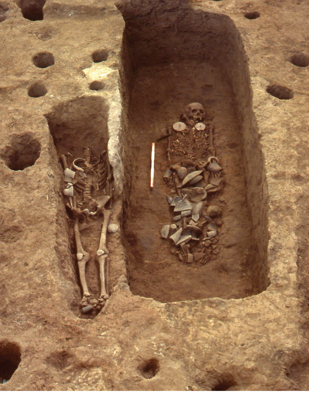 RIGHT I cannot explain why the Princess of Khok Phanom Di (right) was buried at the same time as a headless man in a shallow adjacent grave (left).