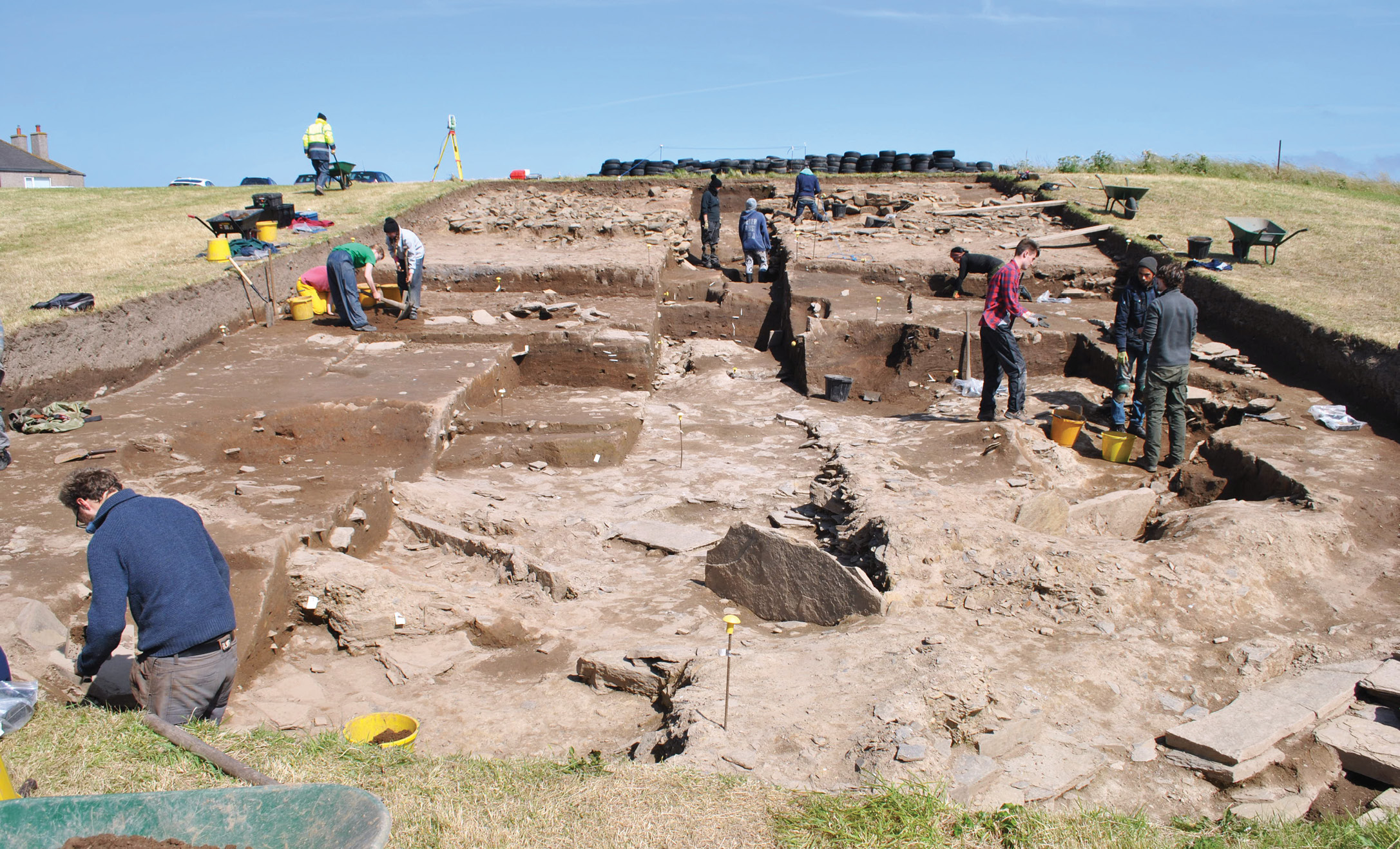 above Looking up the slope towards the midden mound. The remains of Structure 27 can be seen in the foreground.