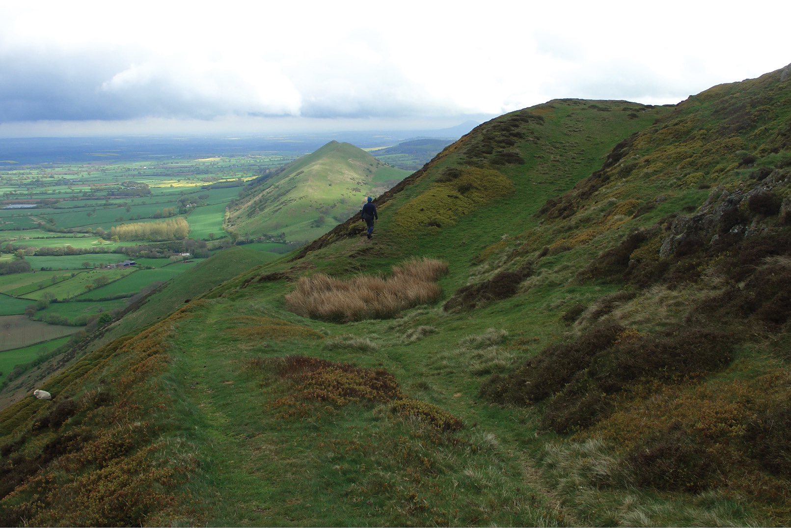right Caer Caradoc (‘the fort of Caradog’) overlooks Church Stretton in Shropshire. Here we can see the rampart line of the hillfort on its summit that gives the landmark its name.