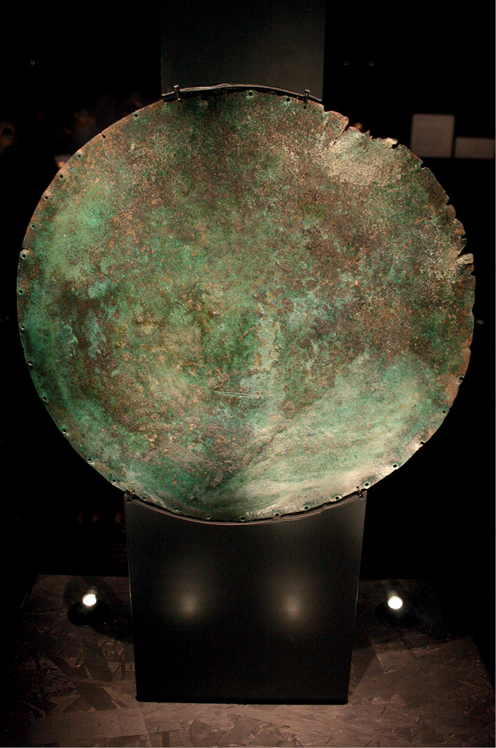 left The other side of the Sky Disc. The copper used to make the bronze was seemingly sourced from the Austrian Alps.