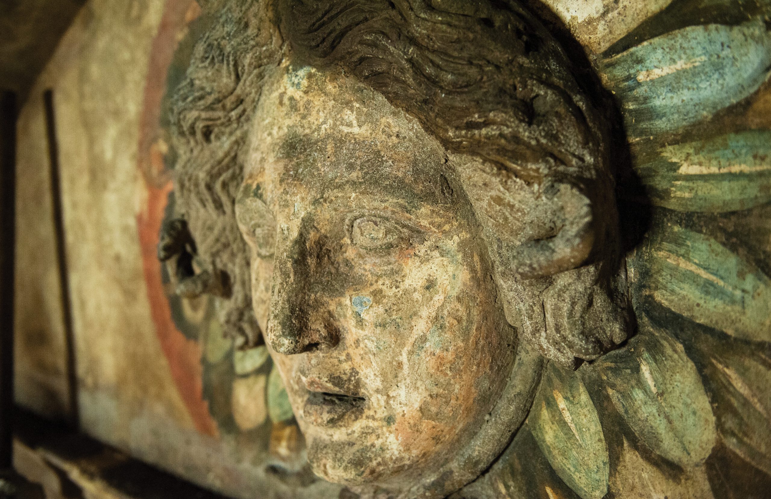 Above The carved limestone head of Medusa in Hypogeum C of the 4th-century BC Ipogeo dei Cristallini in Naples.