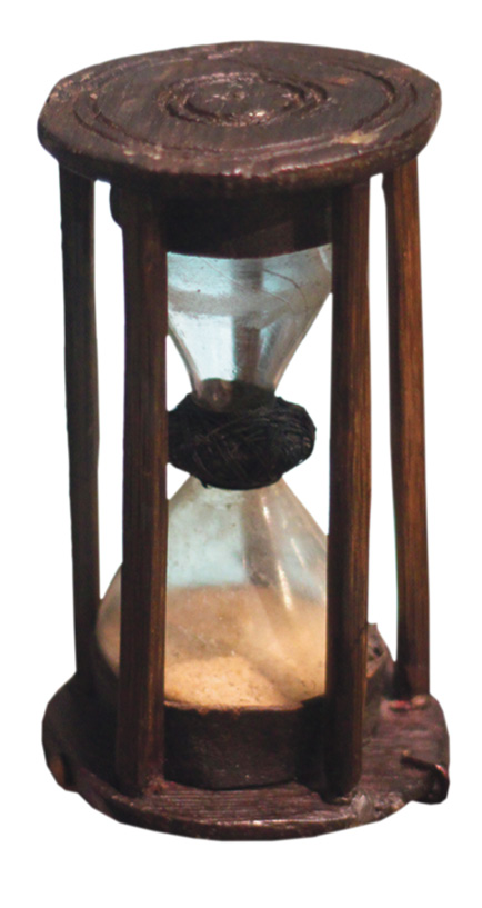 right The Invincible was exceptionally fast: so much so that it used a 14-second sand timer (shown here) to calculate the ship’s speed. Sailors would have thrown a ‘log line’ into the sea, on to which was attached a rope with evenly spaced knots tied in it. They would then count the knots as the rope slid over the side, until the sand in the timer ran out normally they would use a 28-second timer, but because the Invincible was so swift, they needed a 14-second one (otherwise they would have needed a very long rope). Below A ‘deadeye’ from the wreck of the Invincible, so-called because its holes (used to guide rigging) were thought to make it look like a skull.