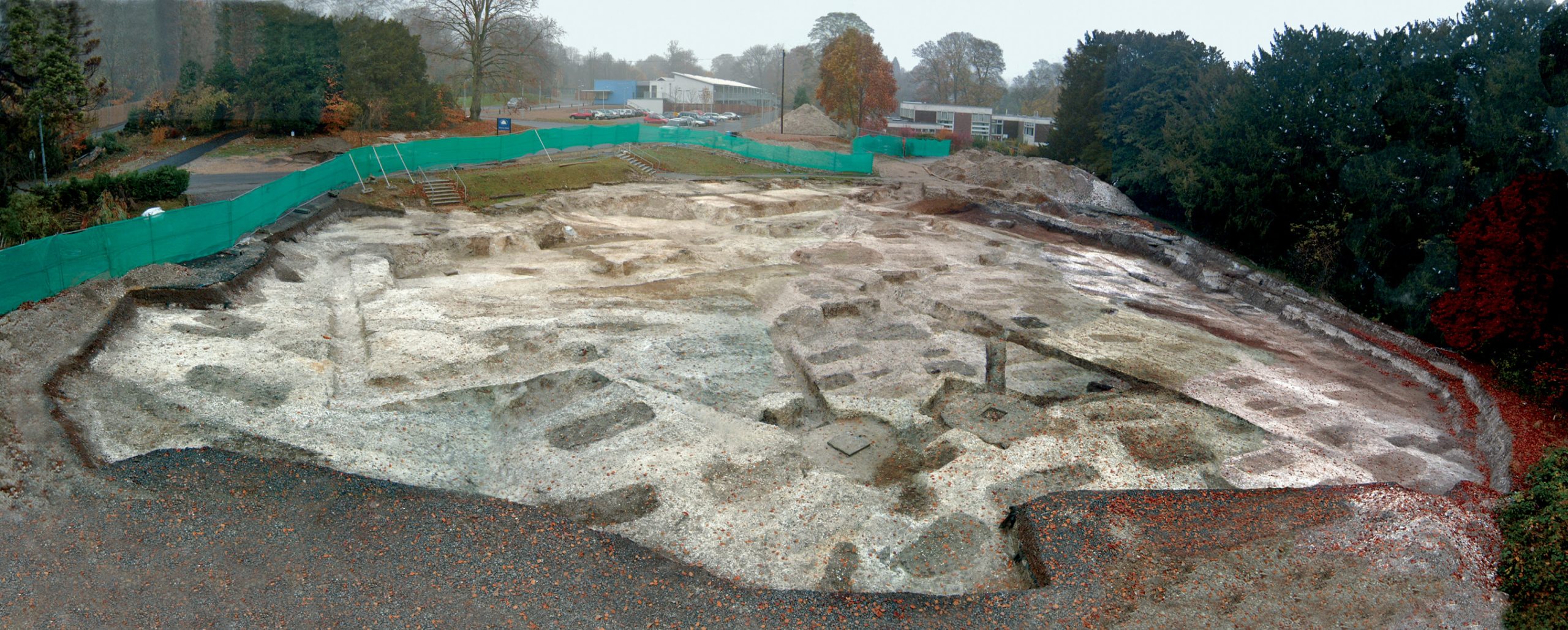 TOP An overall view of the portion of the site excavated by OA, seen from the south after cleaning, with multiple graves and damage caused by construction of the School House visible. Burials were crammed into the ditch marking the original eastern edge of the cemetery (INSET), before spreading out into the plot beyond.