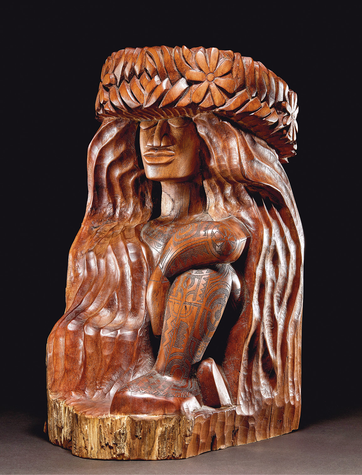 right Tom Pico, Tiare Wahine. ‘Ōhi‘a wood; Hawai’i, 2001. Size: 46.4 x 2.5.5 x 33cm