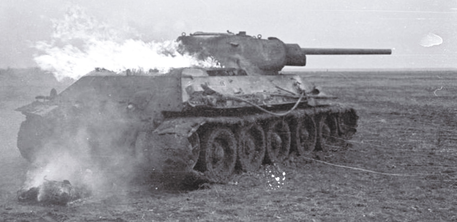 LEFT A Soviet T-34 tank burns on the Eastern Front the victim of a German 88 (88mm anti-tank gun).