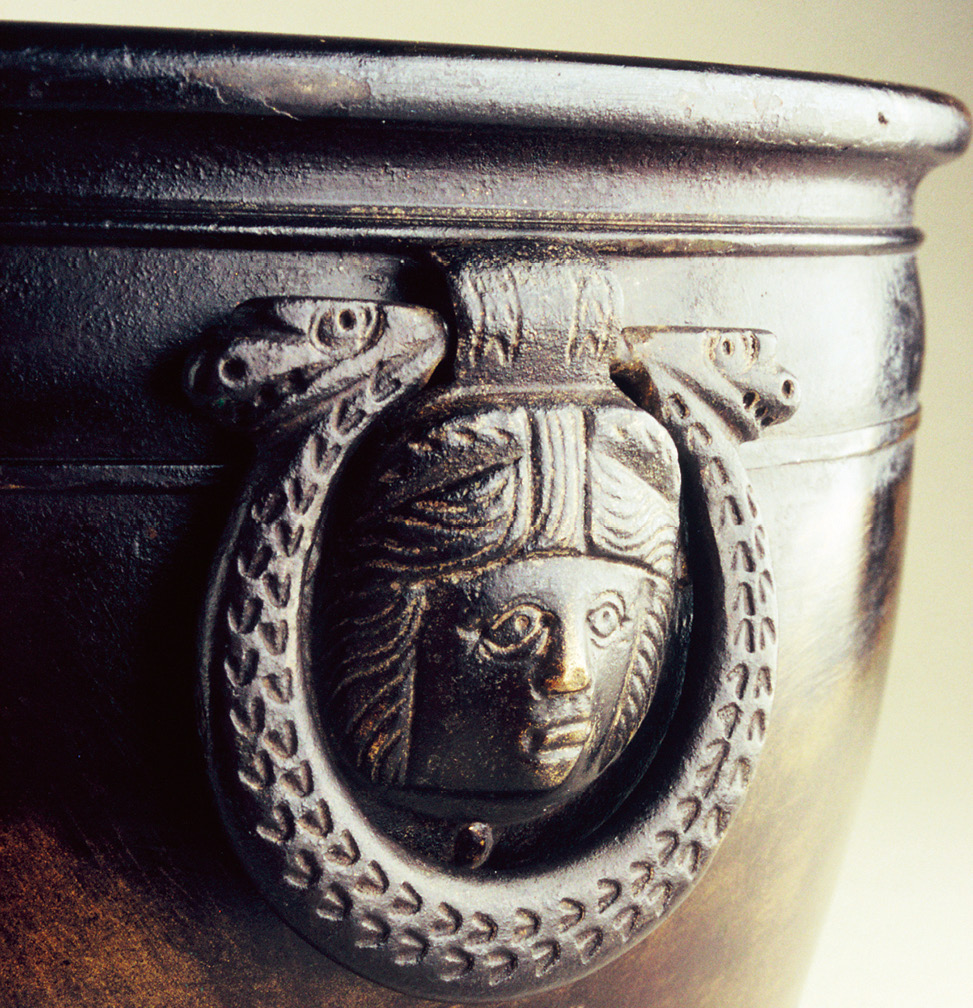 BELOW This spectacular bronze patera comes from an Iron Age crannog, an artificial lake dwelling, at Dowalton in Wigtownshire. The detail shows the Medusa-head carrying handle.