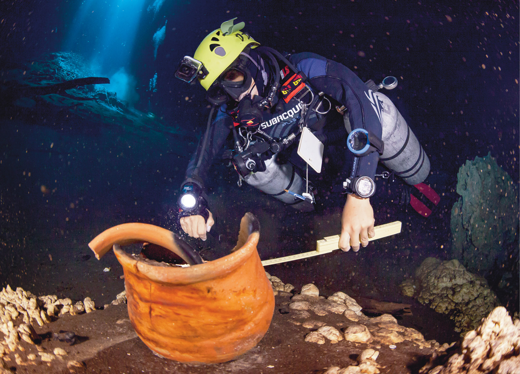 right The registration, protection, and study of submerged cultural heritage are all objectives of the Great Maya Aquifer project. Here a diver is examining a Maya pot.