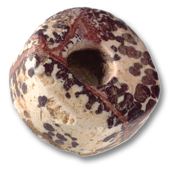 ABOVE A bead of multicoloured stone (lithomarge) from Blackchester in the Borders. Beads like this, typical for the Scottish Iron Age, are found on forts along Hadrian’s Wall.
