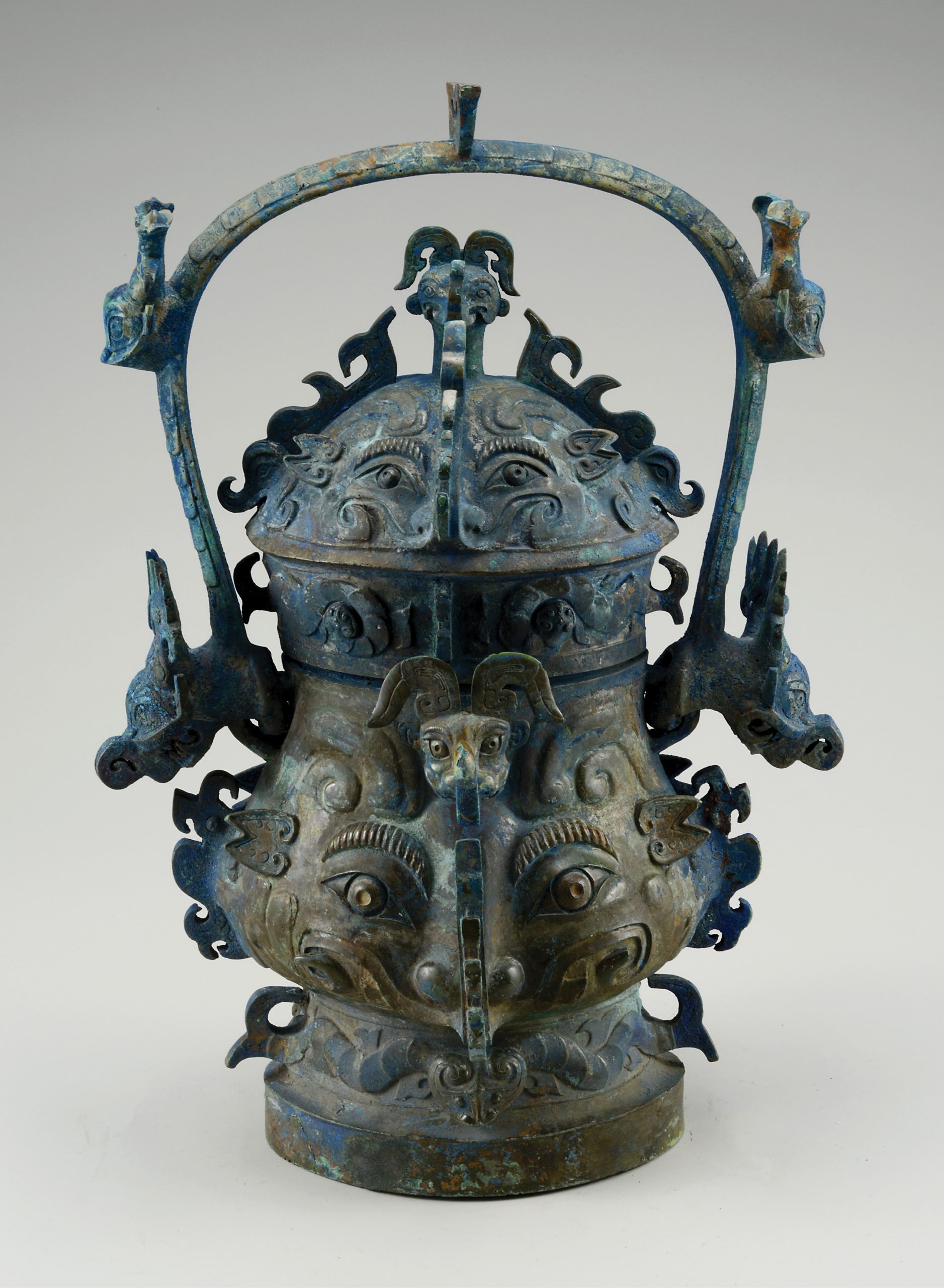 opposite Lidded you wine vessel with beast decoration, from E tomb no. 4 at Yangzishan, Suizhou. Bronze, 1000-900 BC. Size: 49.5cm tall