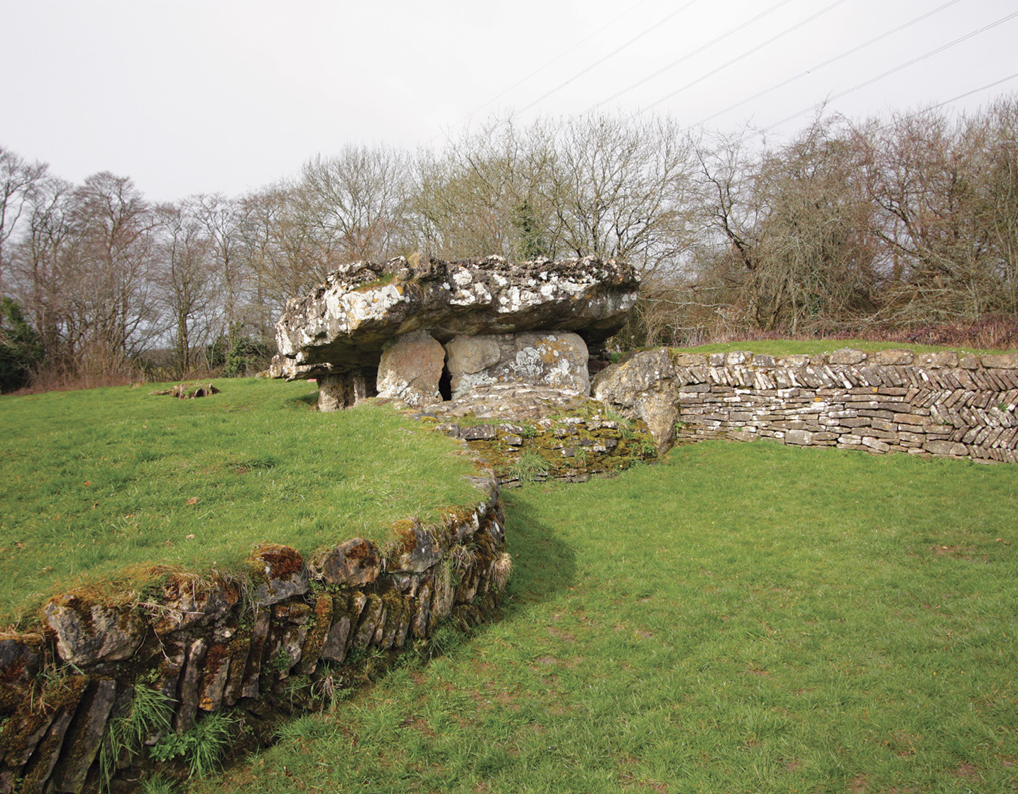 RIGHT The Tinkinswood burial chamber, west of Cardiff in the Vale of Glamorgan, is an example of a dolmen that was subsequently encased within a massive long cairn, turning it from a freestanding monument into a chambered tomb in which the remains of at least 40 people were buried.