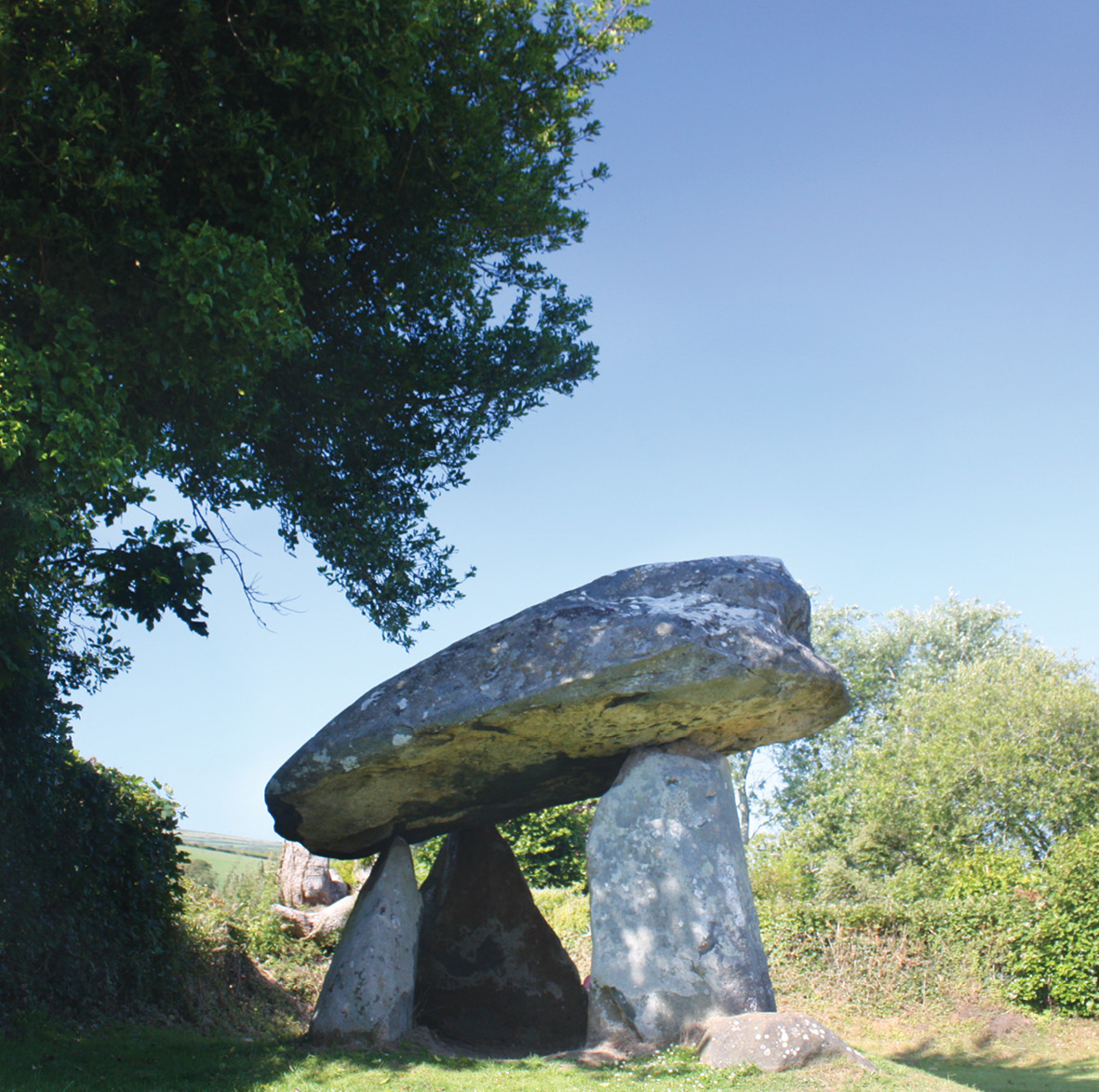 BELOW The capstone at Carreg Coetan, Pembrokeshire (left), has the mushroom shape that indicates it was probably made from a split boulder; the Trethevy Quoit capstone’s wedge shape (right) is more typical of a dolmen formed by levering an in-situ slab out of the ground.