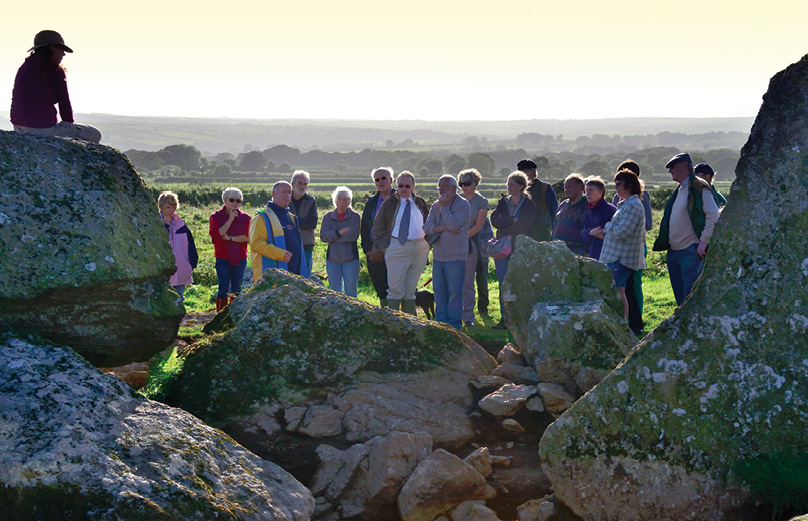 left Archaeological outreach: explaining the latest finds from the dig.
