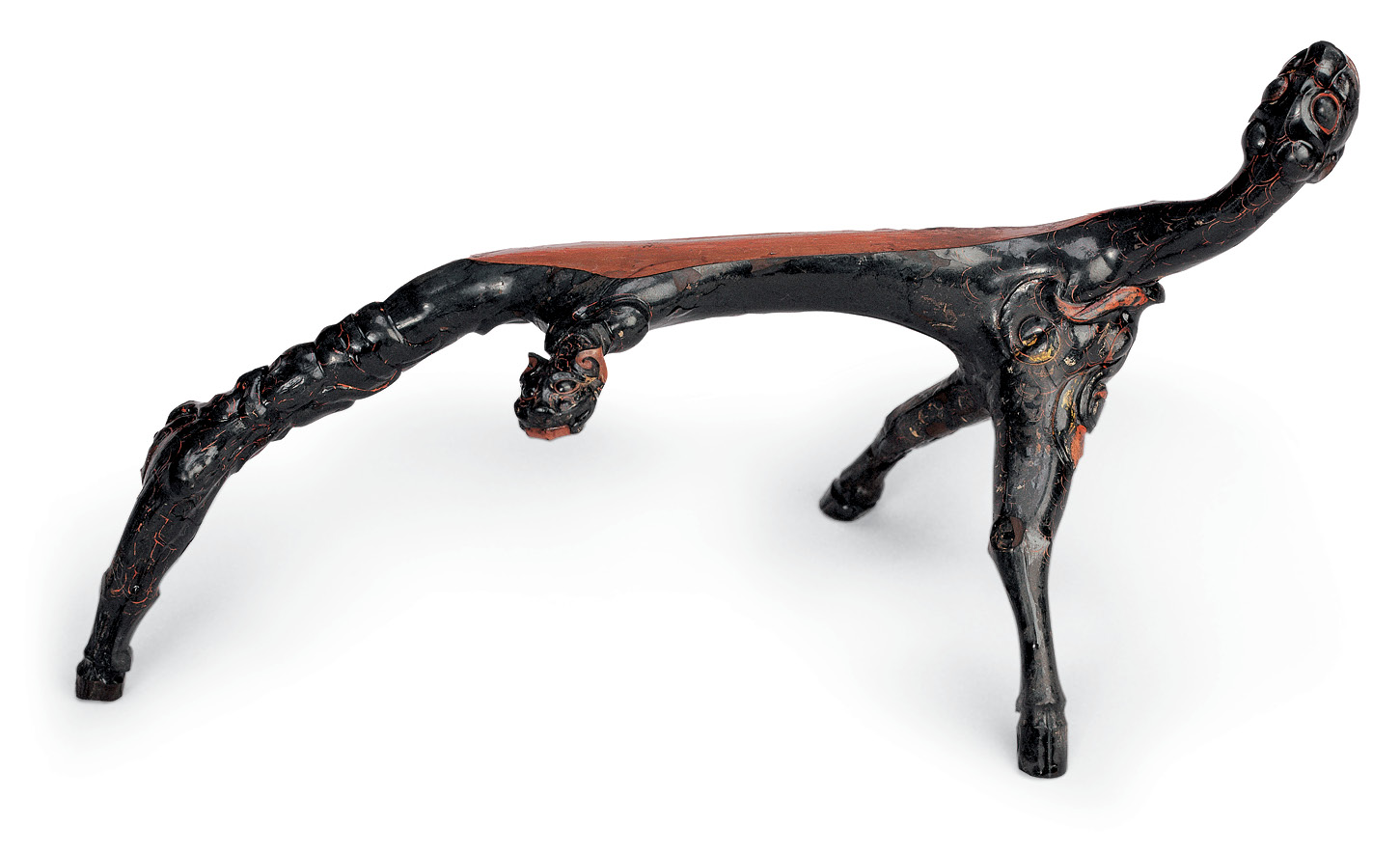 below Tomb beast, from Chu tomb no. 2 at Jiuliandun, Zaoyang. Lacquer on wood with pigments, c.300 BC. Size: 17.9 x 39.9 x 16.8cm