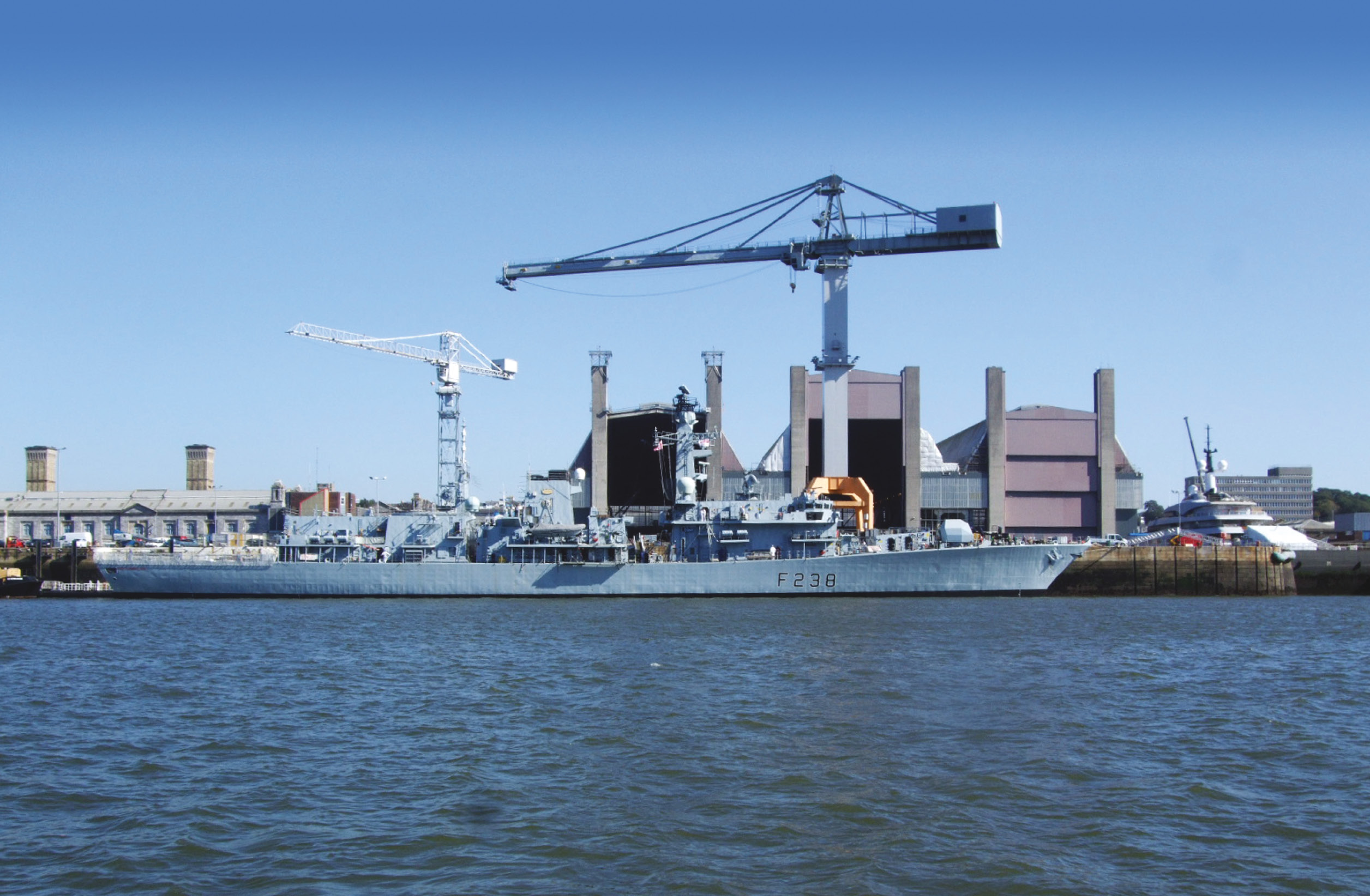 Above Ship of war: HMS Northumberland lies docked in Devonport. The impressive refit facility can be seen in the background.