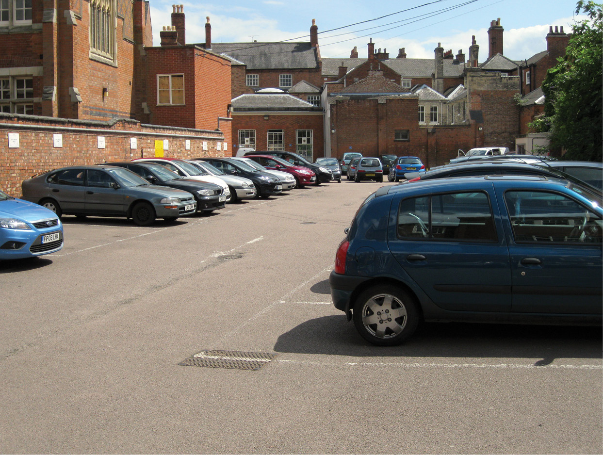 above The site of Greyfriars. Prior to the dig, this was the Leicester City Council Social Services car park. right Looking north along trench 2 as Medieval masonry begins to emerge in the trench. The site of trench 1 is visible in the tarmac beyond.