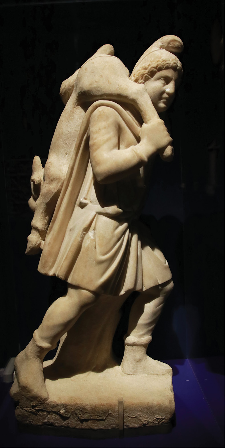 left Some depictions of the tauroctony also include other scenes from the same story, like this sculpture showing Mithras carrying the bull, which he has already overpowered, to the cave where the killing is to take place.