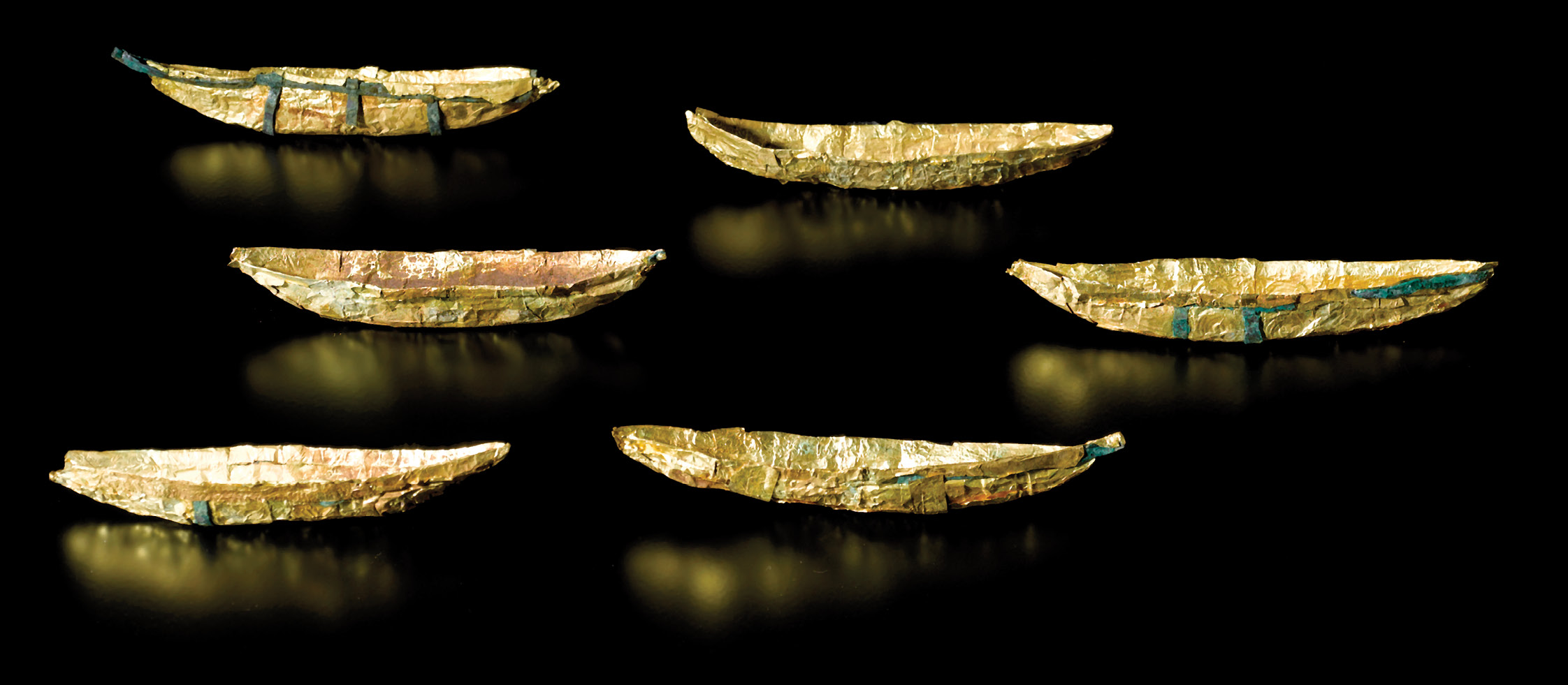 Above Some of the small gold boats from Bronze Age Nors, which represent the ship that carried the sun through the darkness of the underworld at night. below There are a large number of amber artefacts on display at the museum, including Mesolithic and Neolithic pendants and figurines, like this bear.