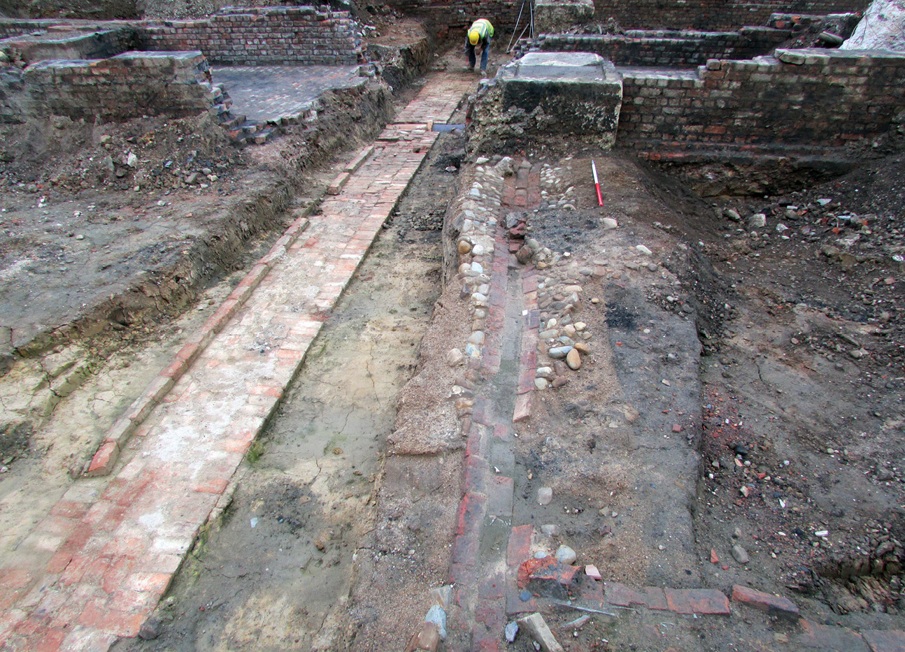 above A long stretch: part of the original boundary wall (shown left), demolished to its foundation level, was found sealed beneath the remains of the railway goods yard that later occupied the prison site.