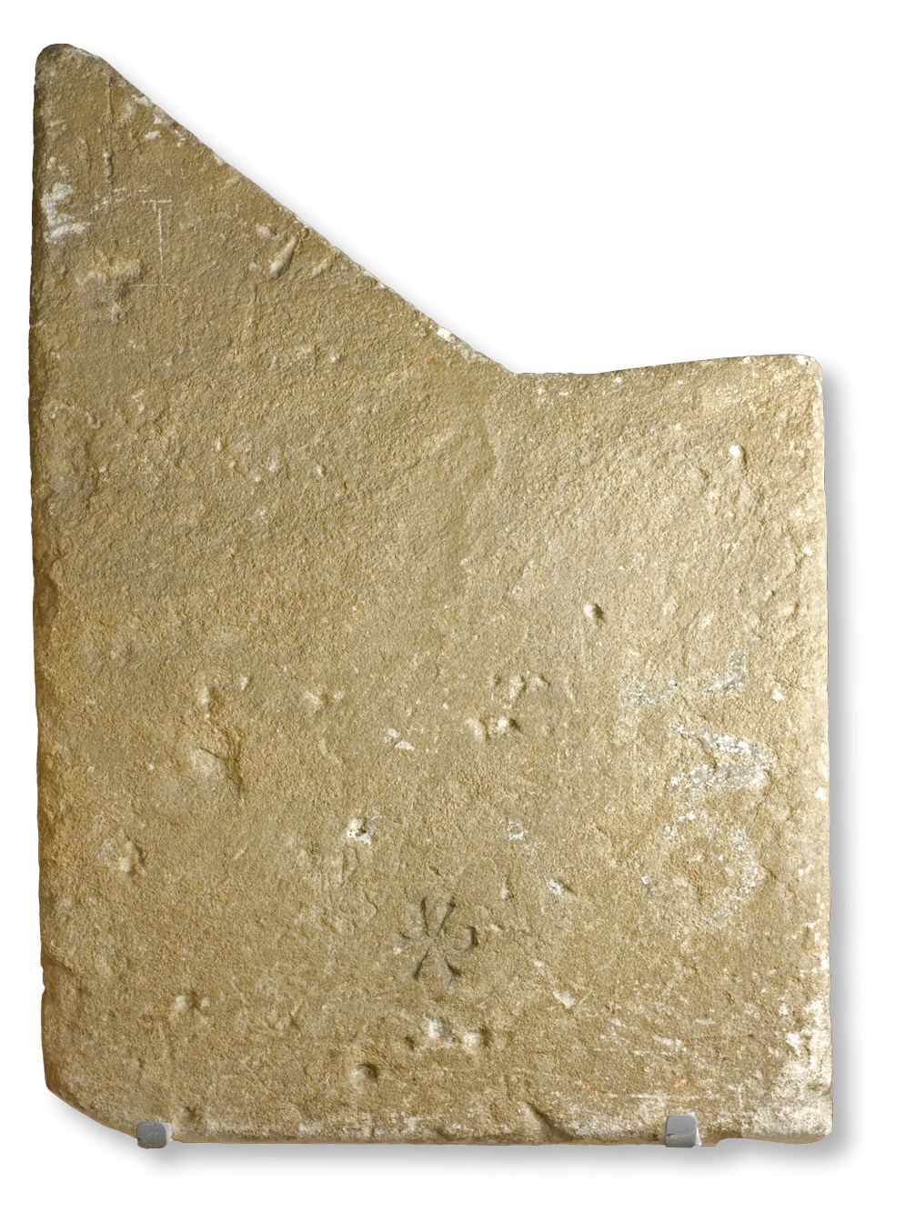 above This coping stone from the nymphaeum, a temple of the nymphs, was later marked with a Christian Chi-Rho (seen bottom centre). below As part of the re-presentation of the villa to visitors, a series of new reconstruction paintings by Tony Kerins was commissioned, showing the villa at its mid-4th-century peak.