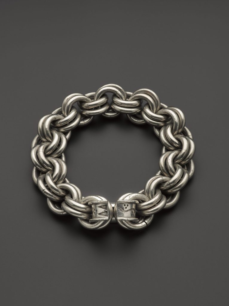 One of early medieval Scotland’s massive silver chains. The terminal ring has been engraved with a symbol found on a sculpted stone.