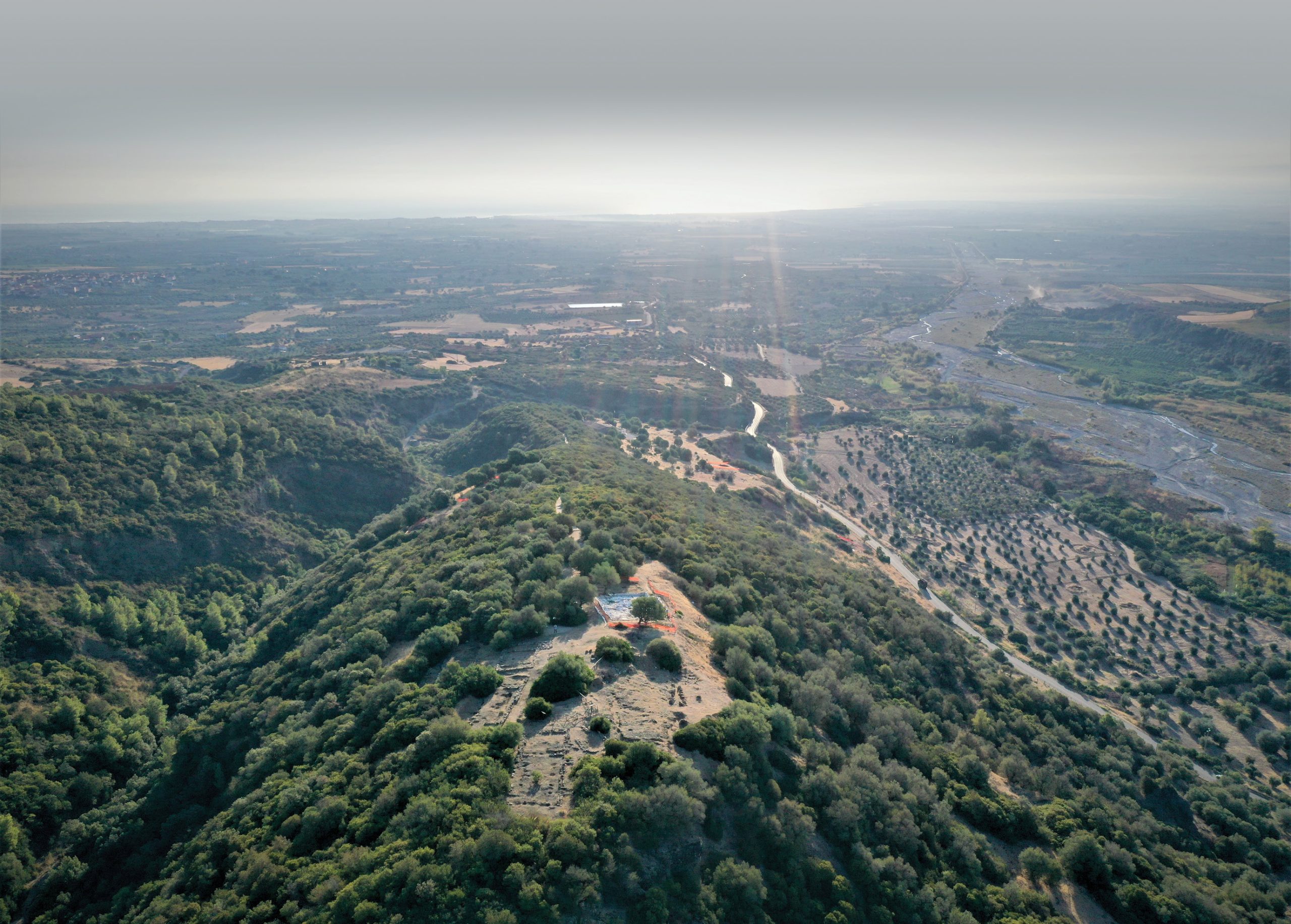 PICTURED A view of Timpone della Motta, looking over the sanctuary at the top of the hill towards the Ionian coast. Excavations here are shedding fascinating new light on the
