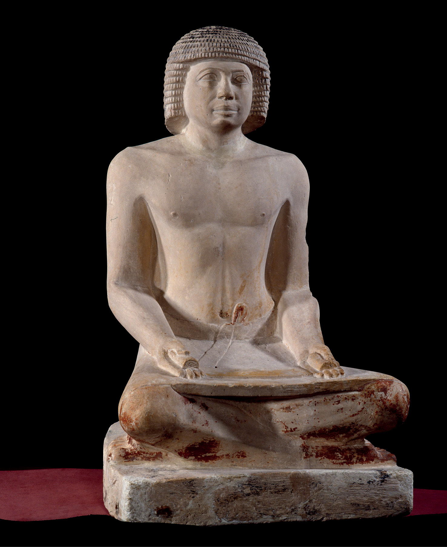 below A limestone statue of a scribe from Egypt. It has been estimated that only about 1% of the population would have been able to read hieroglyphics.