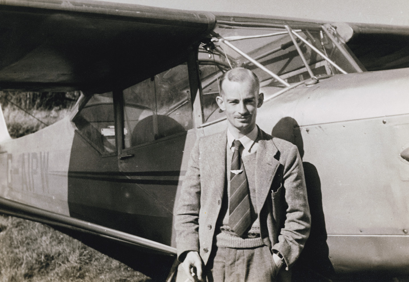 LEFT Harold Wingham standing beside an Auster J/5-160 light aircraft.