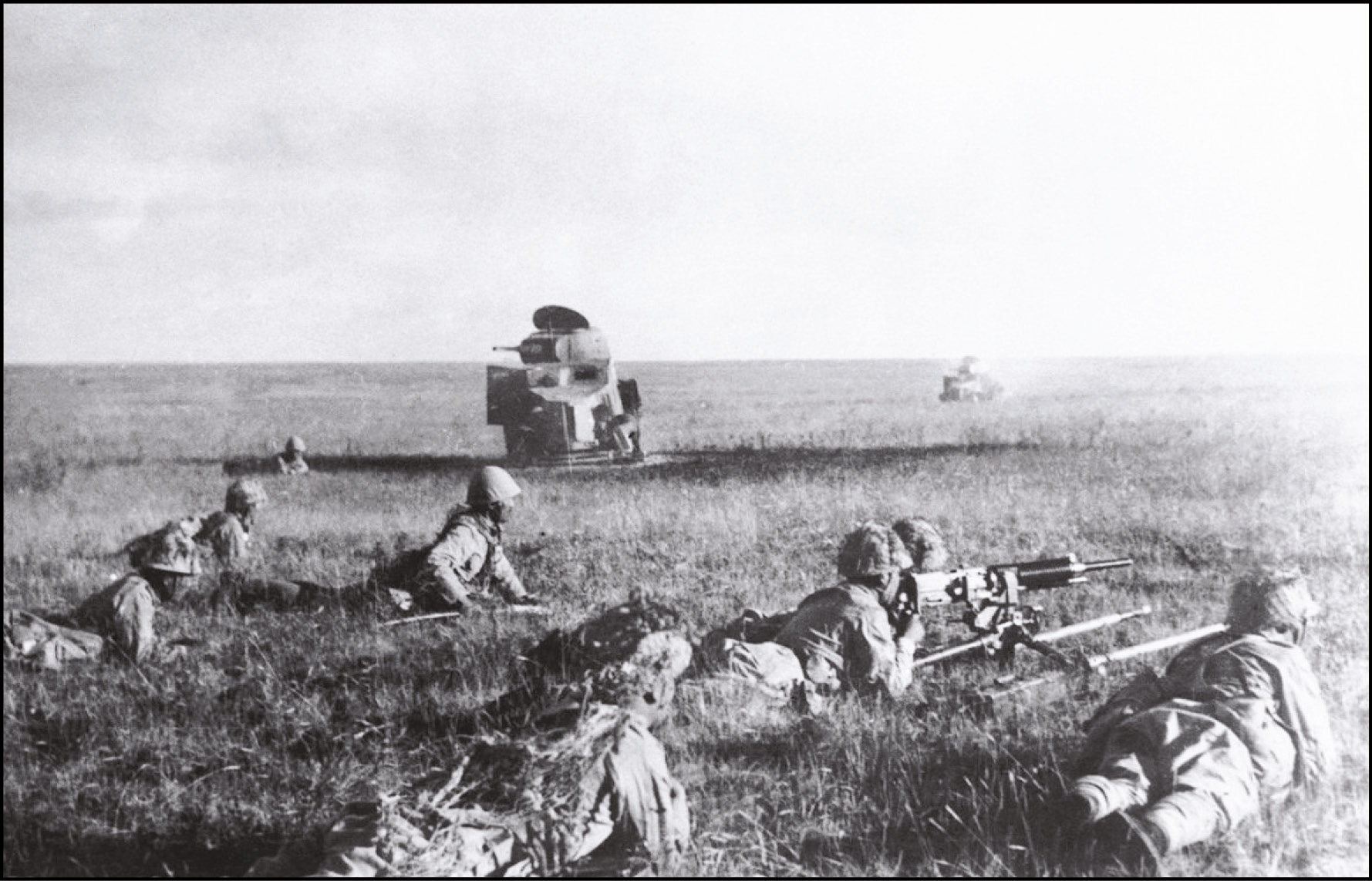 right Japanese soldiers creeping in front of wrecked Soviet armoured cars during the summer of 1939.