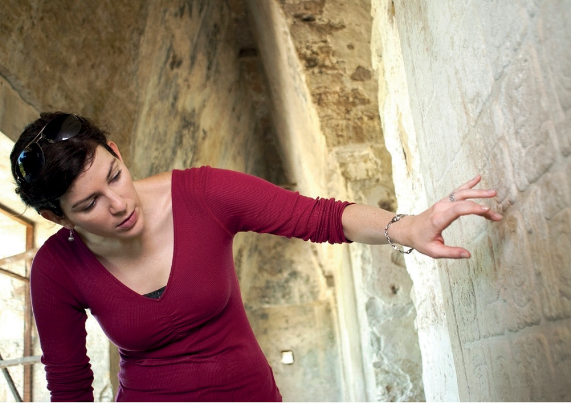 5. Kara interpreting Mayan hieroglyphs on the wall of a temple in Palenque in Mexico. In Discovery Channel’s Out of Egypt, she compared pyramids in Egypt with those in Mexico and Sri Lanka. © Discovery Communications. 6. Kara examining a skeleton in a Late Antique burial ground in the Fayum region of Egypt. © Discovery Communications.