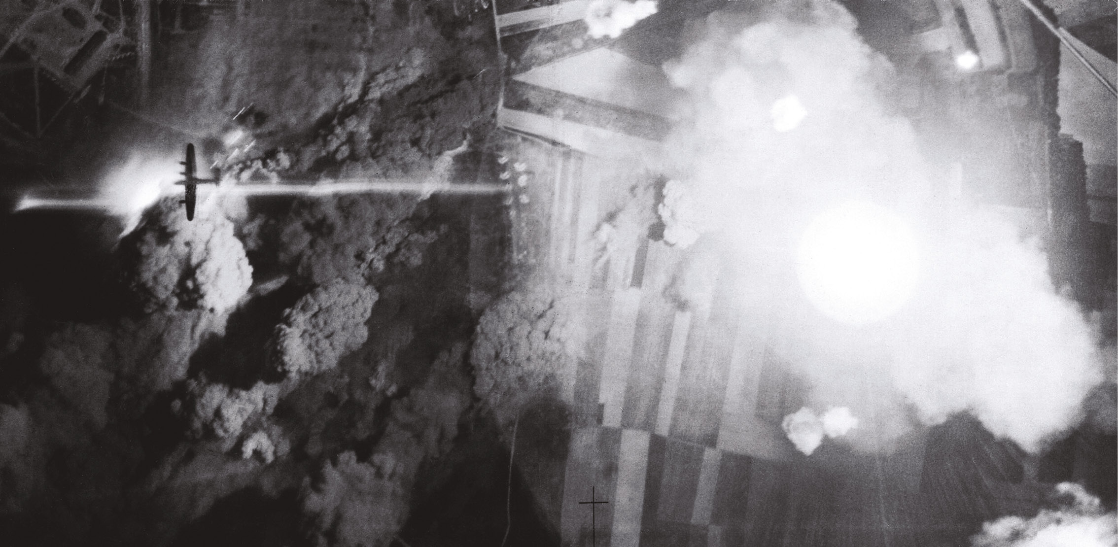 ABOVE A Lancaster bomber is silhouetted by flares and exploding bombs over Mailly-le-Camp.