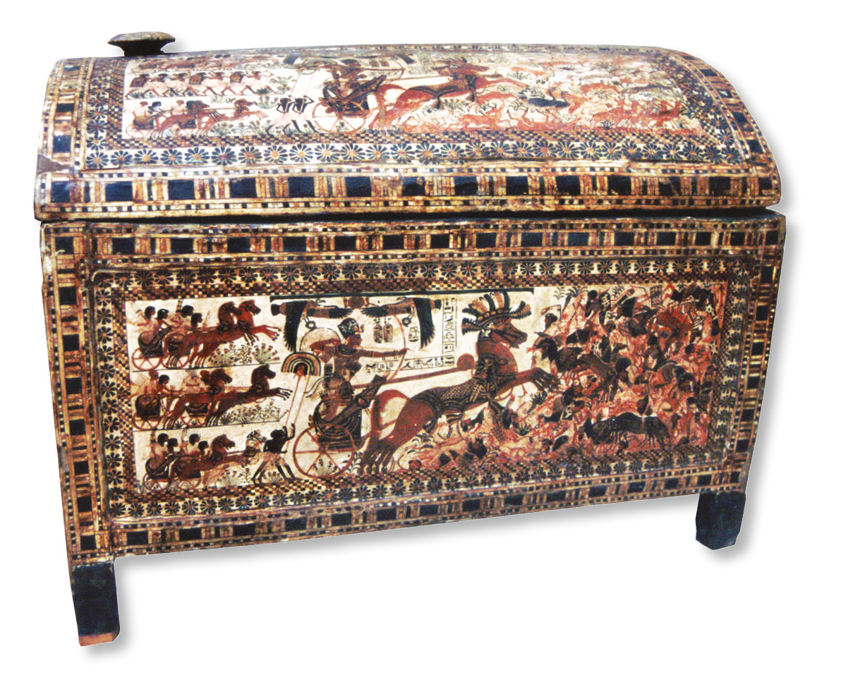 Left The painted wooden chest with scenes of Tutankhamun charging into battle. A detail from one of these scenes is shown on page 14. Below A gold fan or sunshade from the tomb of Tutankhamun, which would have been fitted with ostrich feathers. The scene on the handle shows a triumphant king in his chariot returning from the hunt, preceded by bearers carrying the ostriches he has killed.