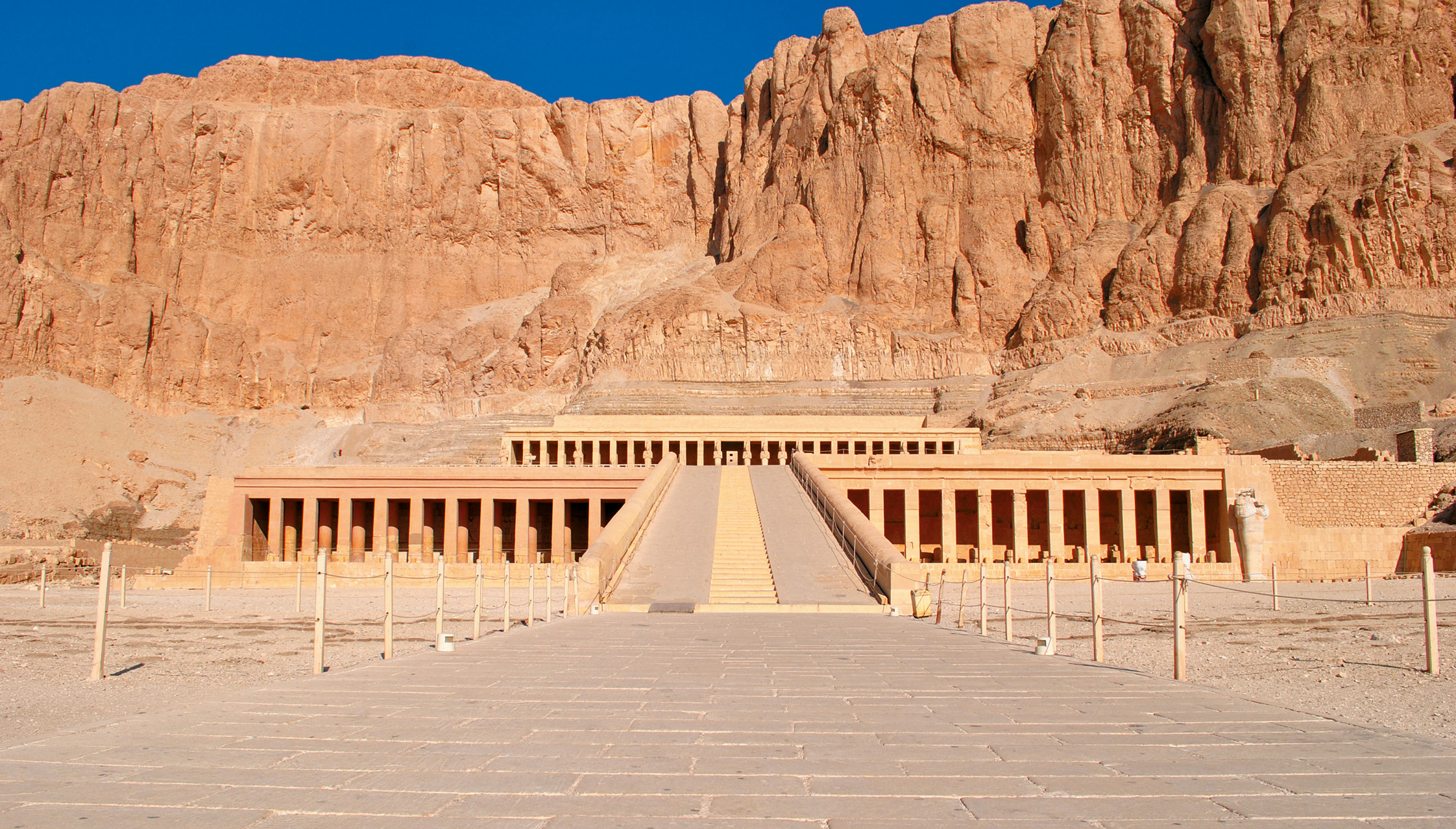above The mortuary temple of Hatshepsut at Deir el-Bahri, where Carter worked under the direction of Édouard Naville from 1894 to 1899. left Vernet Carter in 1894 at Deir el-Bahri during the one season he assisted his brother in copying the scenes. He did not return as he could not endure the heat of Egypt.
