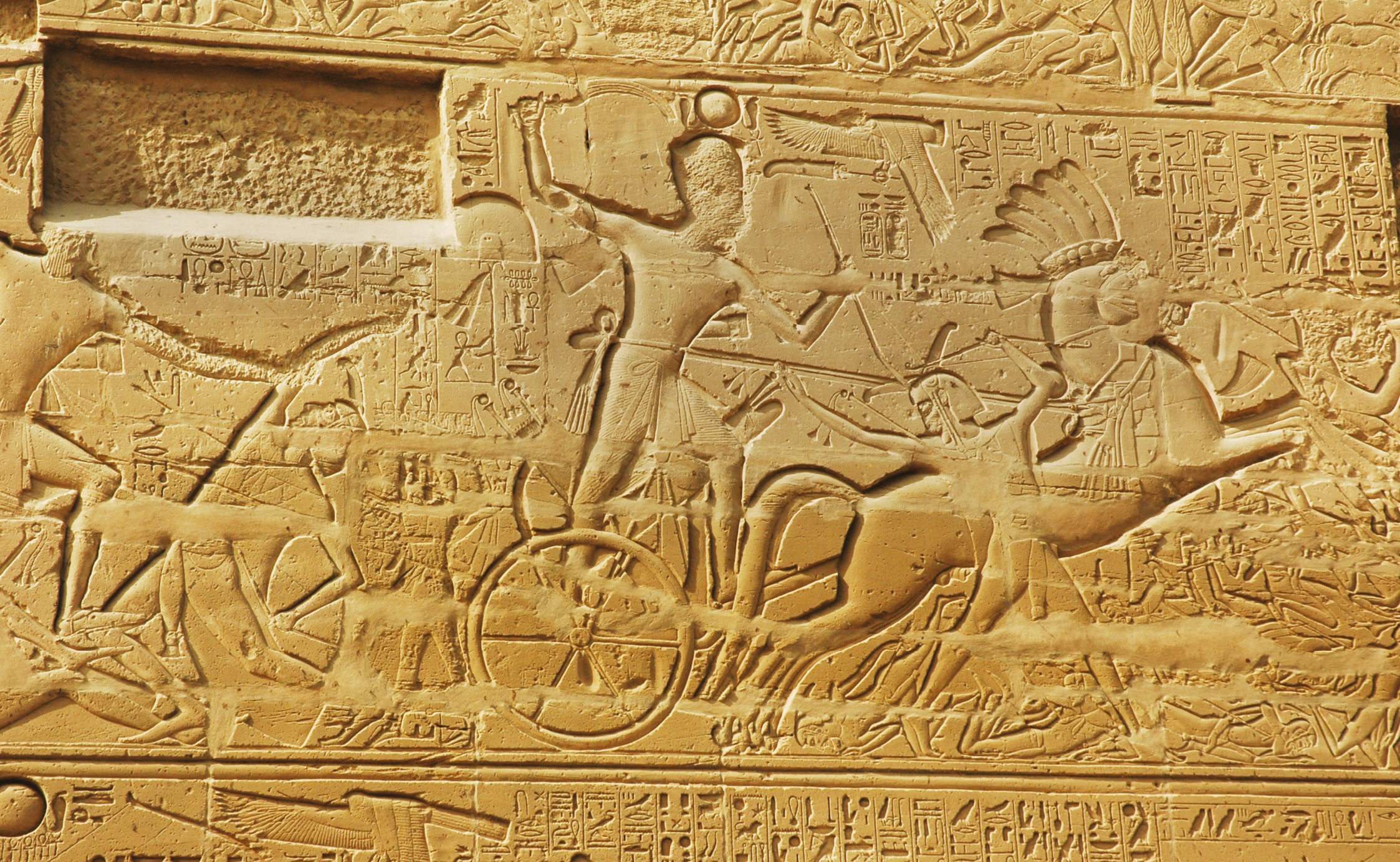 above A Sety I battle scene at Karnak Temple. Blocks discovered near Luxor Temple show that Tutankhamun’s reign played a significant part in the development of such scenes. left A scene from Ramesses III’s mortuary temple at Medinet Habu showing the counting of enemy hands after a battle.