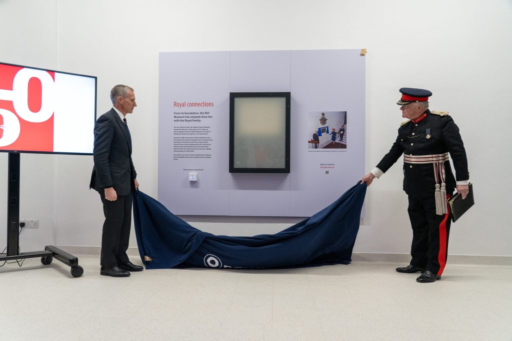 RAF Museum Chair ACM Sir Stephen Hillier (left) and the Representative Deputy Lieutenant for the London Borough of Barnet Martin Russell (right) unveil The Royal Charter.