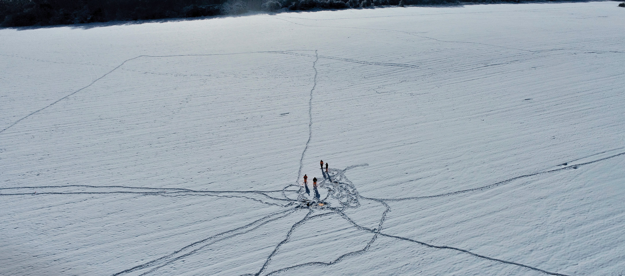 right January 2021 brought challenging weather for the team: here they are shown marking out excavation areas in the snow.