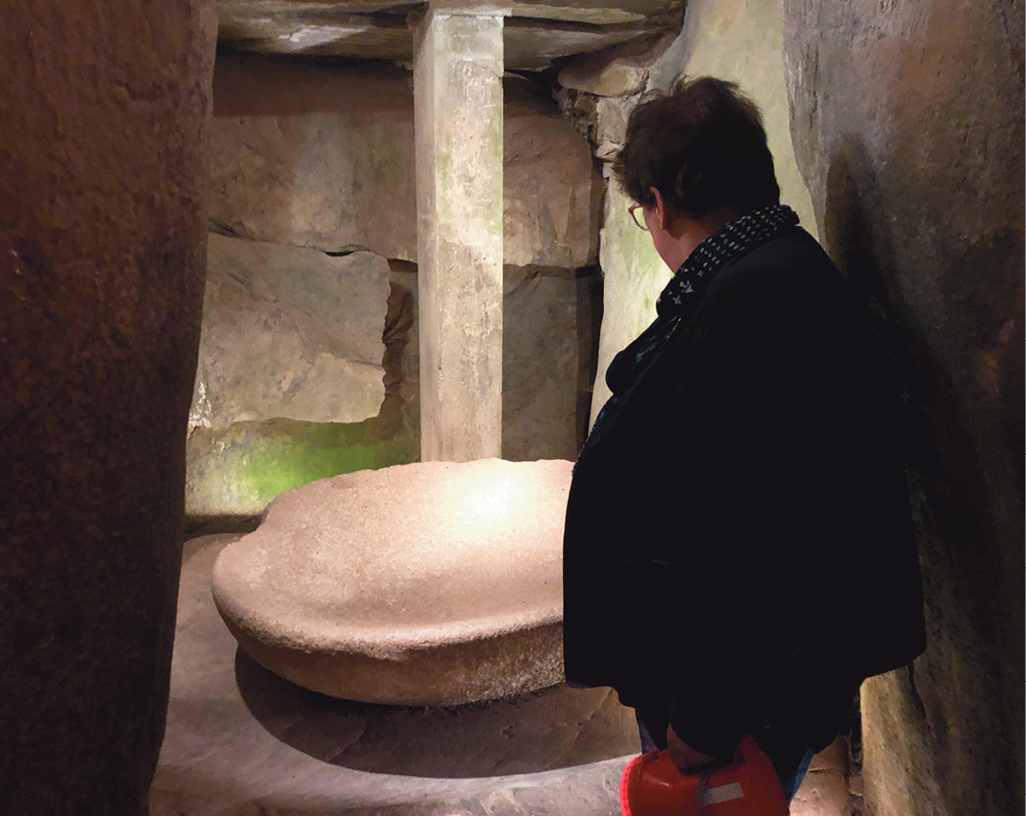 left Clare uses her torch to reveal one of the three sculpted basins placed in chambers at the heart of Newgrange. below left This graceful tri-spiral is just one of the examples of prehistoric art at Newgrange.