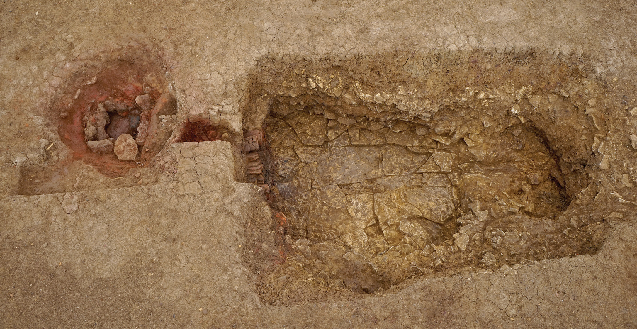 opposite A pottery kiln was discovered close to the Avenue; here (above) a member of the excavation team is shown holding one of its products.