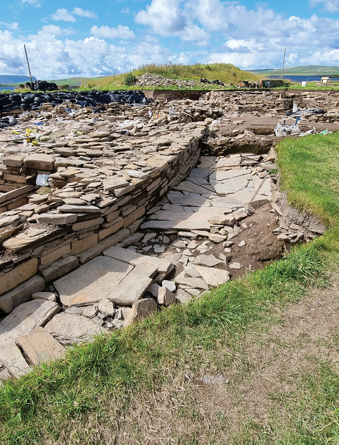 left The structures at the Ness of Brodgar are particularly well-preserved and well-constructed. Here we see the outer wall and paved ‘passageway’ of monumental Structure 10.