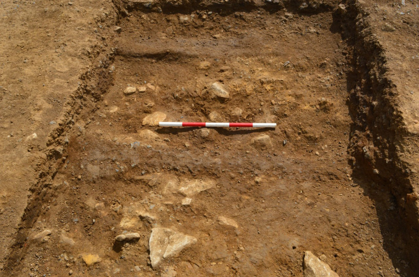 left The dark lines of wheel ruts run horizontally across this image of the road. above A complete seal box recovered during the Priors Hall excavations.