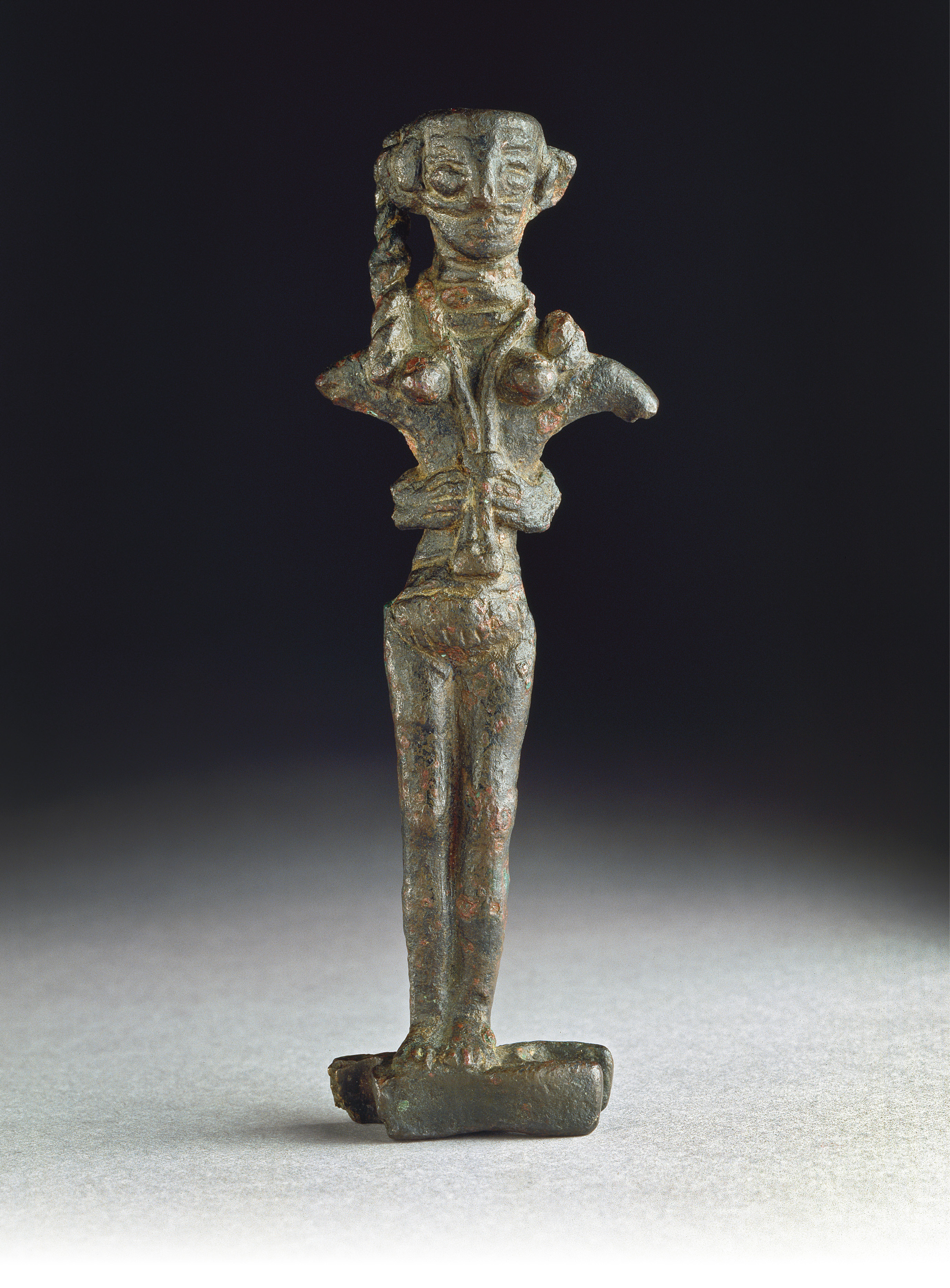Opposite Figure of the goddess Astarte on an oxhide ingot, from Cyprus (possibly Enkomi). Copper alloy, 1200-1100 BC. Size: 9.9 x 3.8 x 1.4cm right Figurine of a mother goddess, from the necropolis of Porto Ferro,