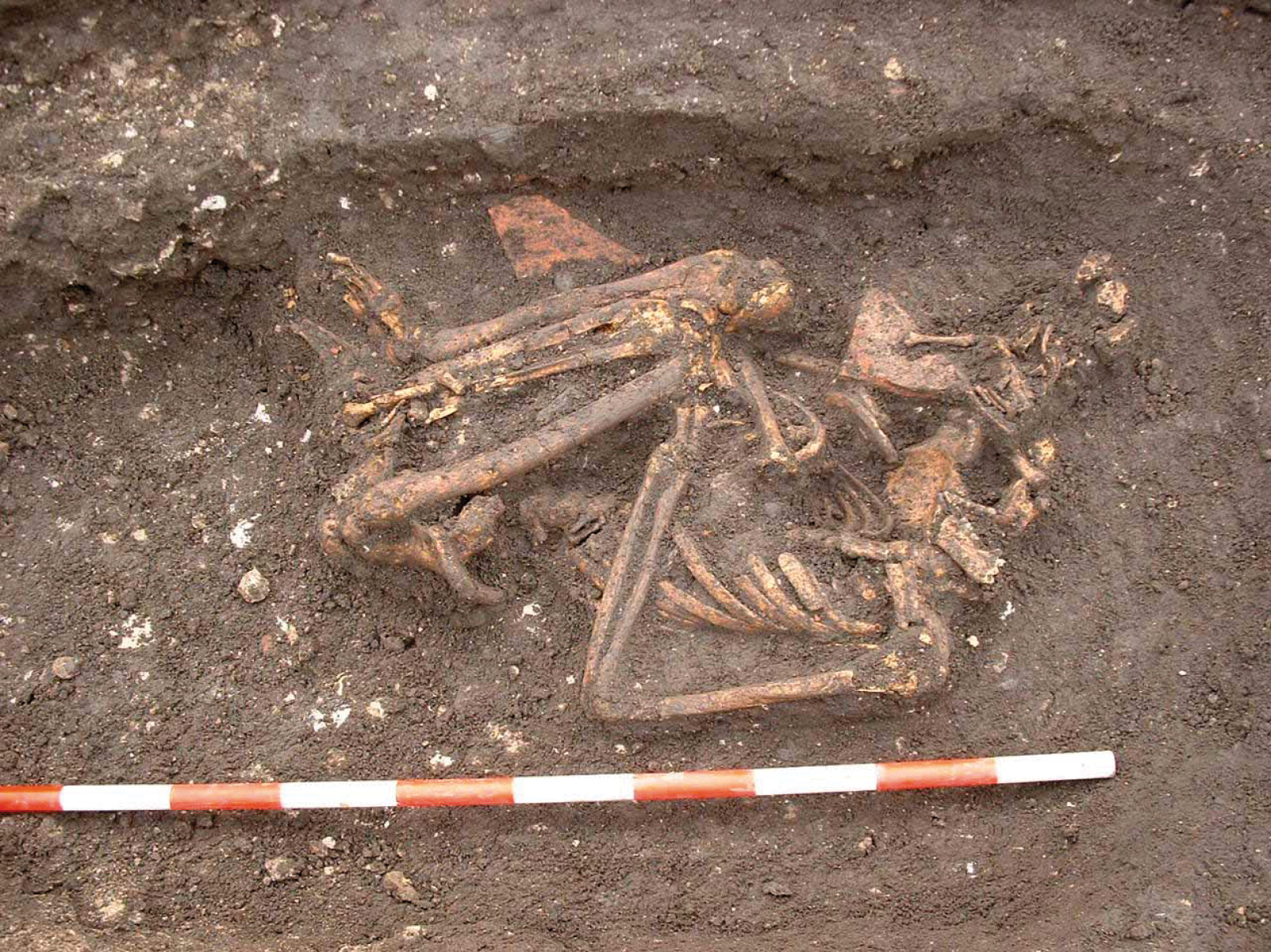 left The crouched burial of a woman was found within the apse of All Saints Church in York.