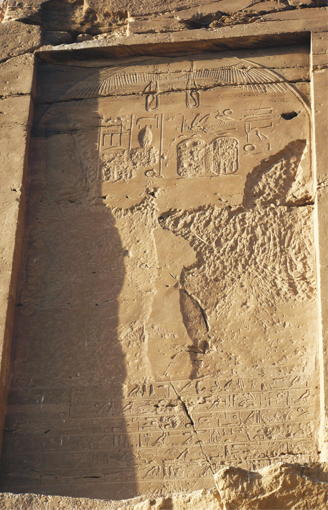 above Stela of Amenhotep IV carved out of the rock face at Gebel el-Silsila. The inscription dates to early in the king’s reign but already reflects his focus on the Aten. below Nefertiti, depicted wearing her distinctive blue crown, on a talatat block at the Brooklyn Museum of Art.