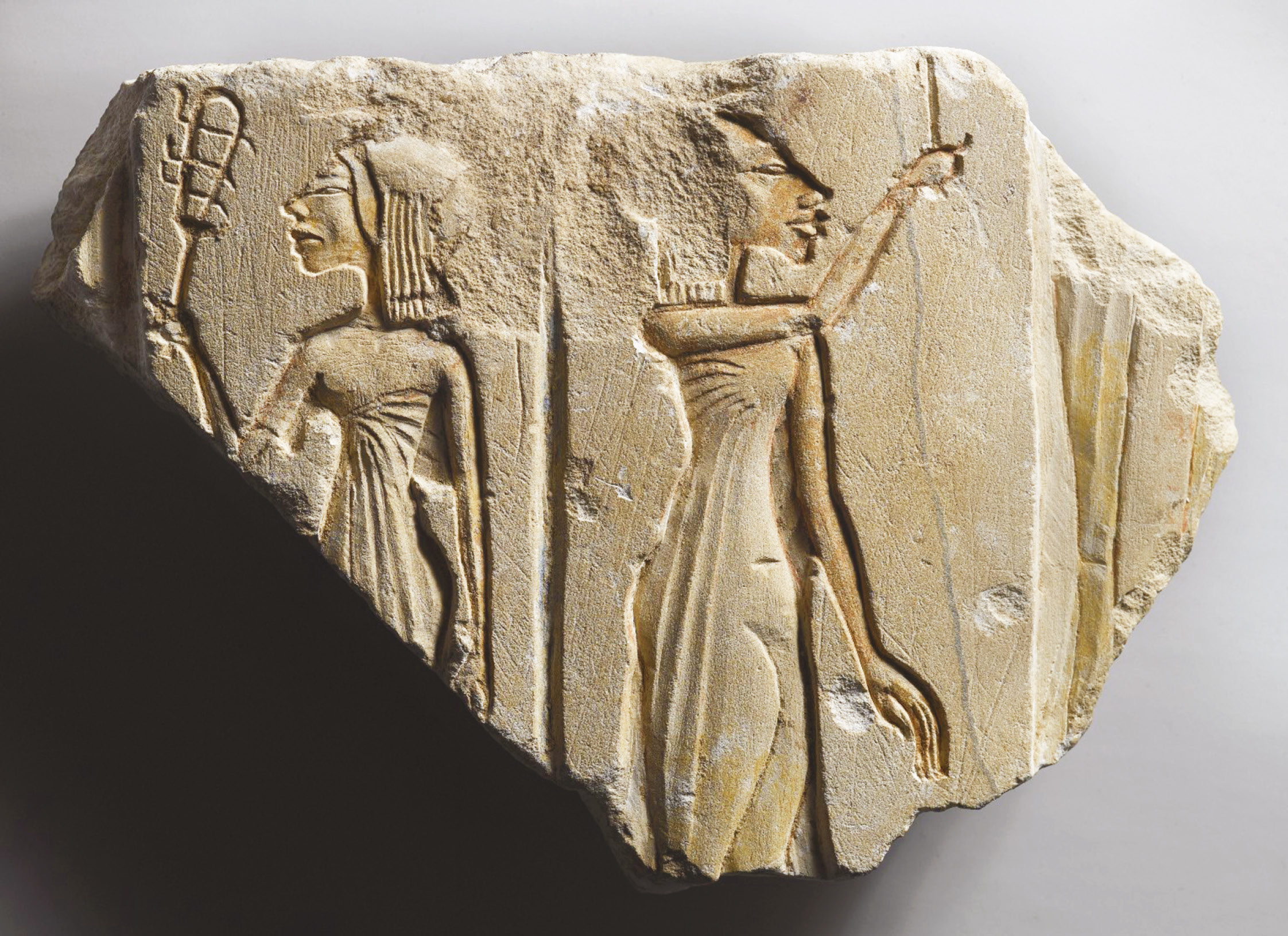 above A relief fragment depicting two of the daughters of Akhenaten and Nefertiti, each shaking a sistrum.