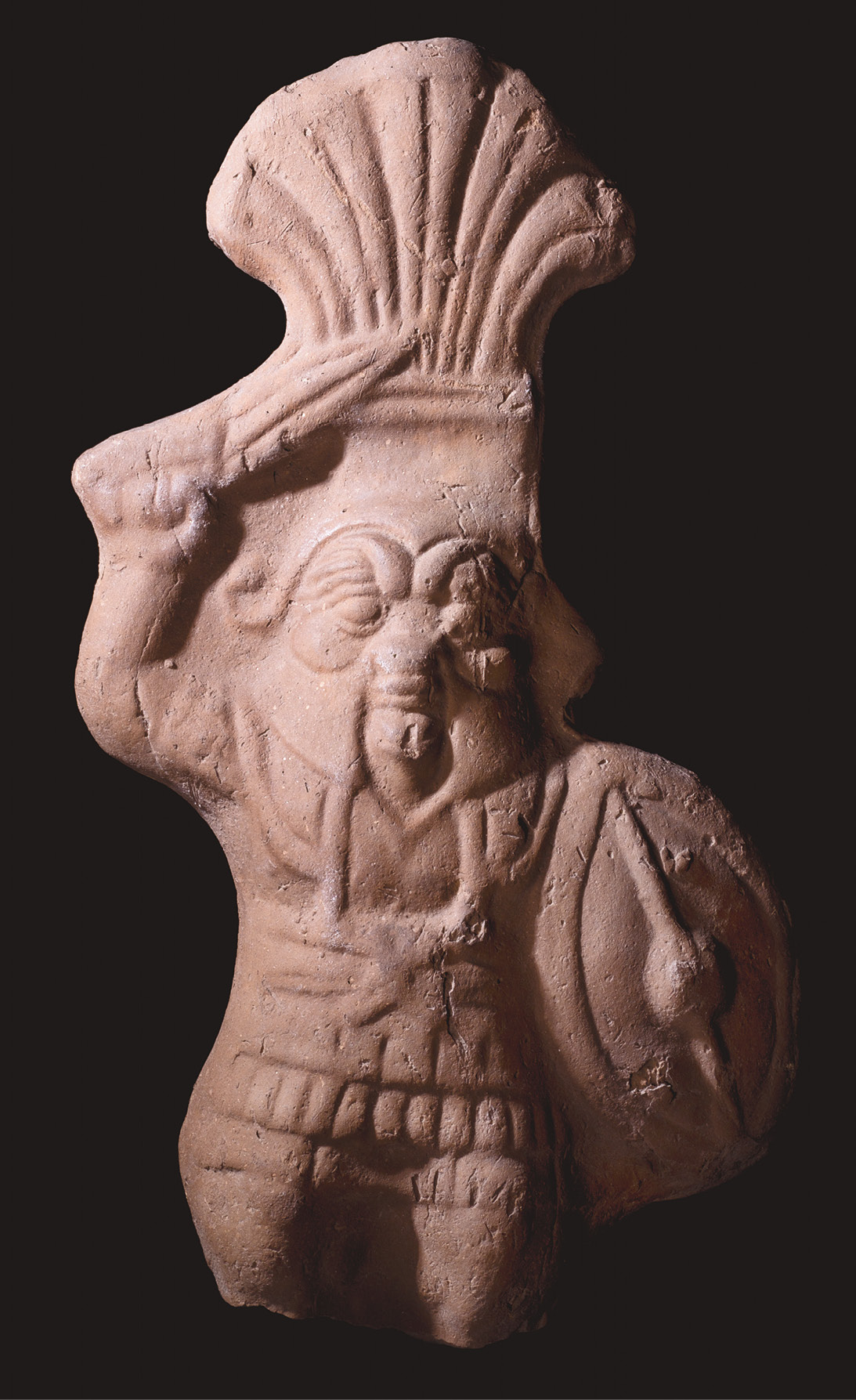 ABOVE A terracotta figurine of the god Bes, dressed in Macedonian armour. c.300 BC-AD 100. ABOVE RIGHT The gilded cartonnage mummy mask for a man, holding a wreath and a book roll. From Hawara, 2nd century AD.