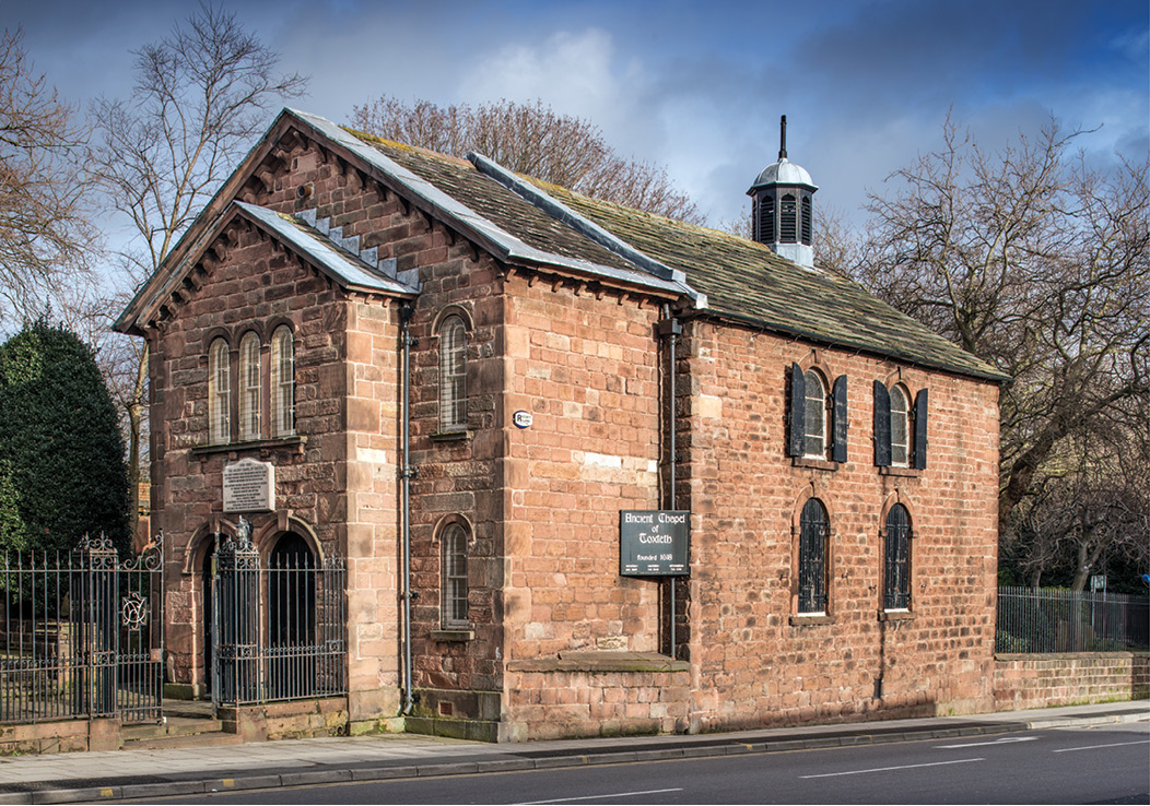 below The Ancient Chapel at Toxteth, Liverpool, was built in the reign of James I (1603-1625) and may be the oldest surviving Nonconformist chapel. The Jacobean chapel was largely rebuilt in the 18th century, but the pew door (just visible at the bottom of the image and to the right of the pillar) is dated to 1650, and the Gothic arch survives from the original chapel, showing that early Nonconfomists did not initially reject medieval church aesthetics.