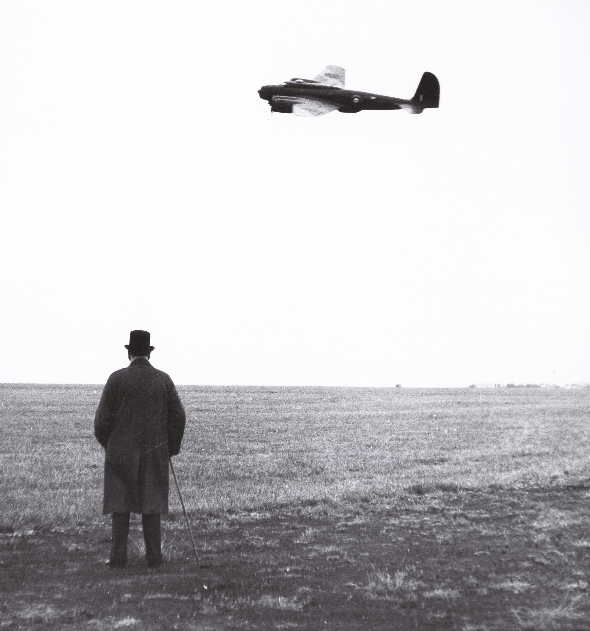left Winston Churchill watches the arrival in Britain