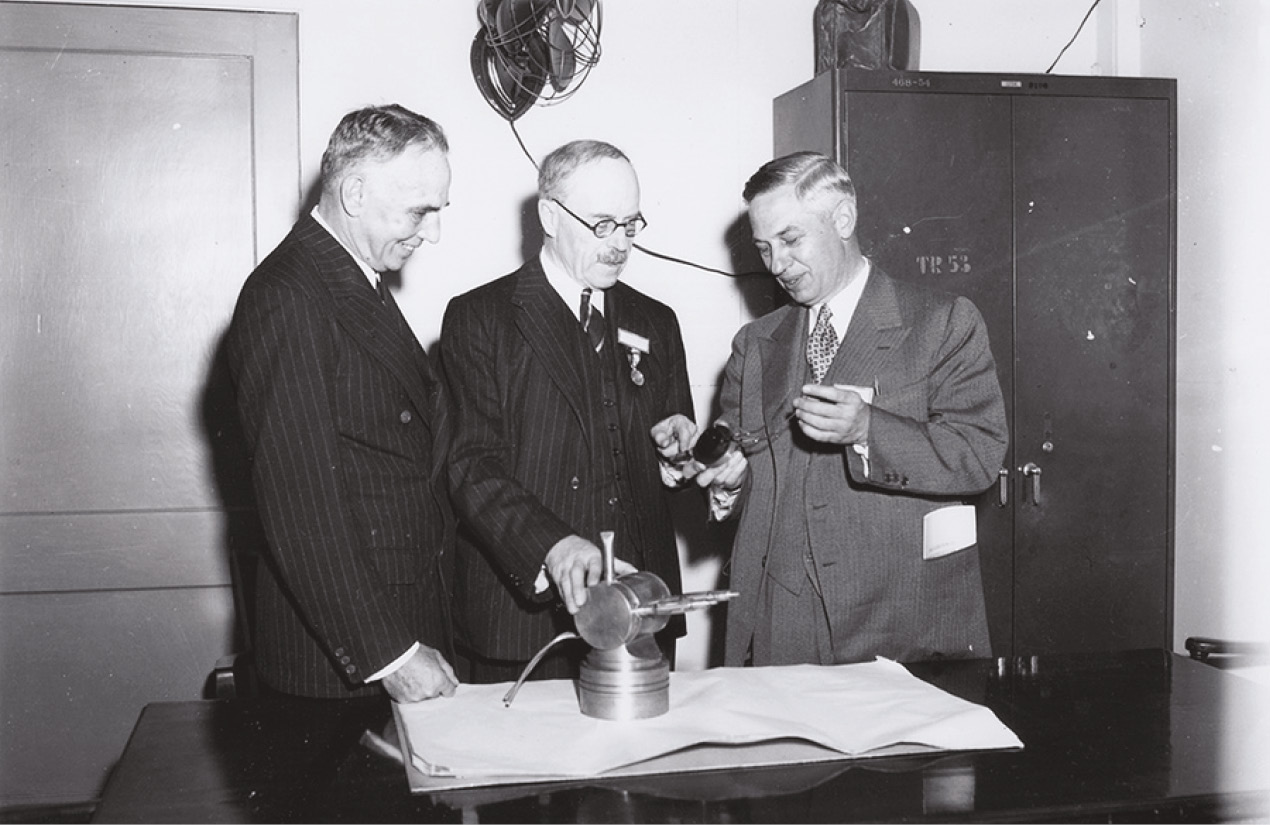 below left The British scientist Henry Tizard [centre] with cavity magnetrons at MIT’s ‘Radiation Laboratory’, or Rad Lab. below right A Lancaster bomber dropping thin slivers of foil known as ‘chaff’ over the German city of Duisburg.