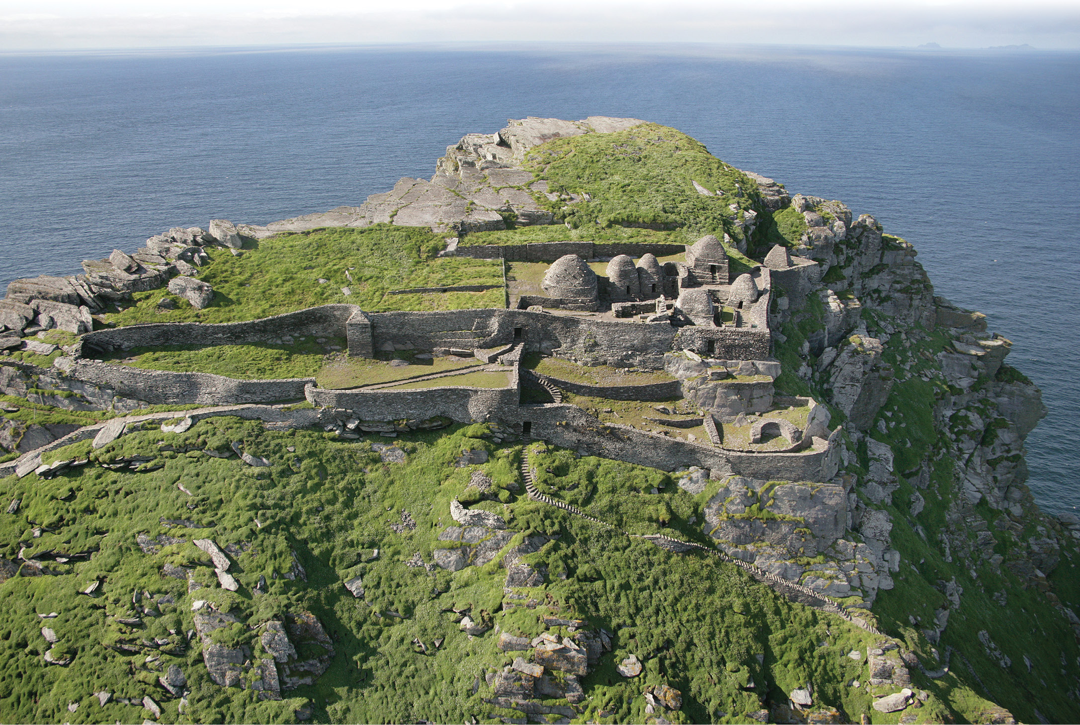 above Prominent in this aerial view are the massive retaining walls that enabled level terraces to be built on the island’s steep slopes. The sheltered lower terraces, known as ‘the monks’ gardens’ were probably used to grow vegetables and grain crops.