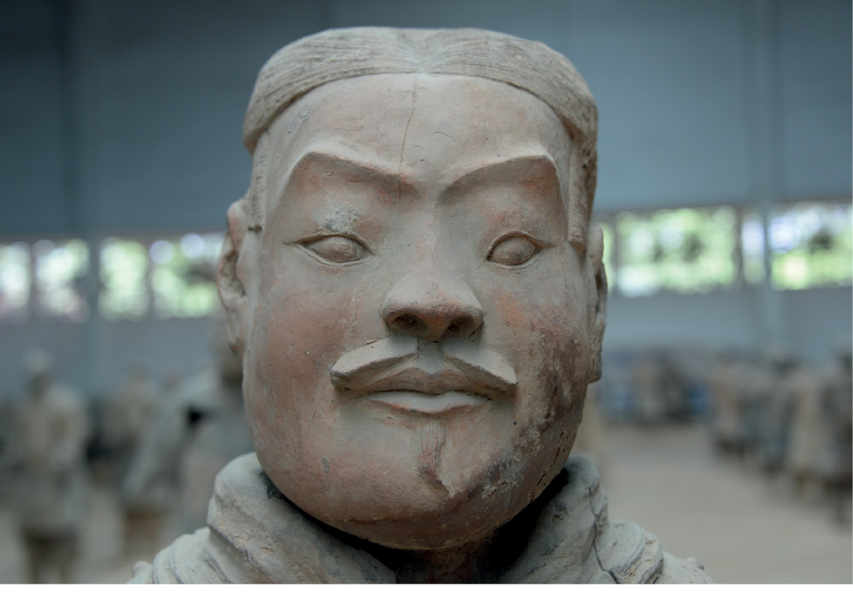 5. 6. and 7. Three warriors from Pit 1, Lintong. Although their faces were pressed in standardised moulds, their eyebrows and noses were reshaped and moustaches added to give the figures more individual appearances. Photograph: Lukas Nickel.